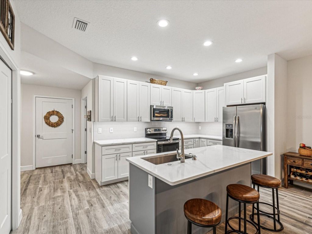 Photo of 1979 Whitney Oaks Boulevard, Clearwater, FL 33760 (MLS # TB8453235)