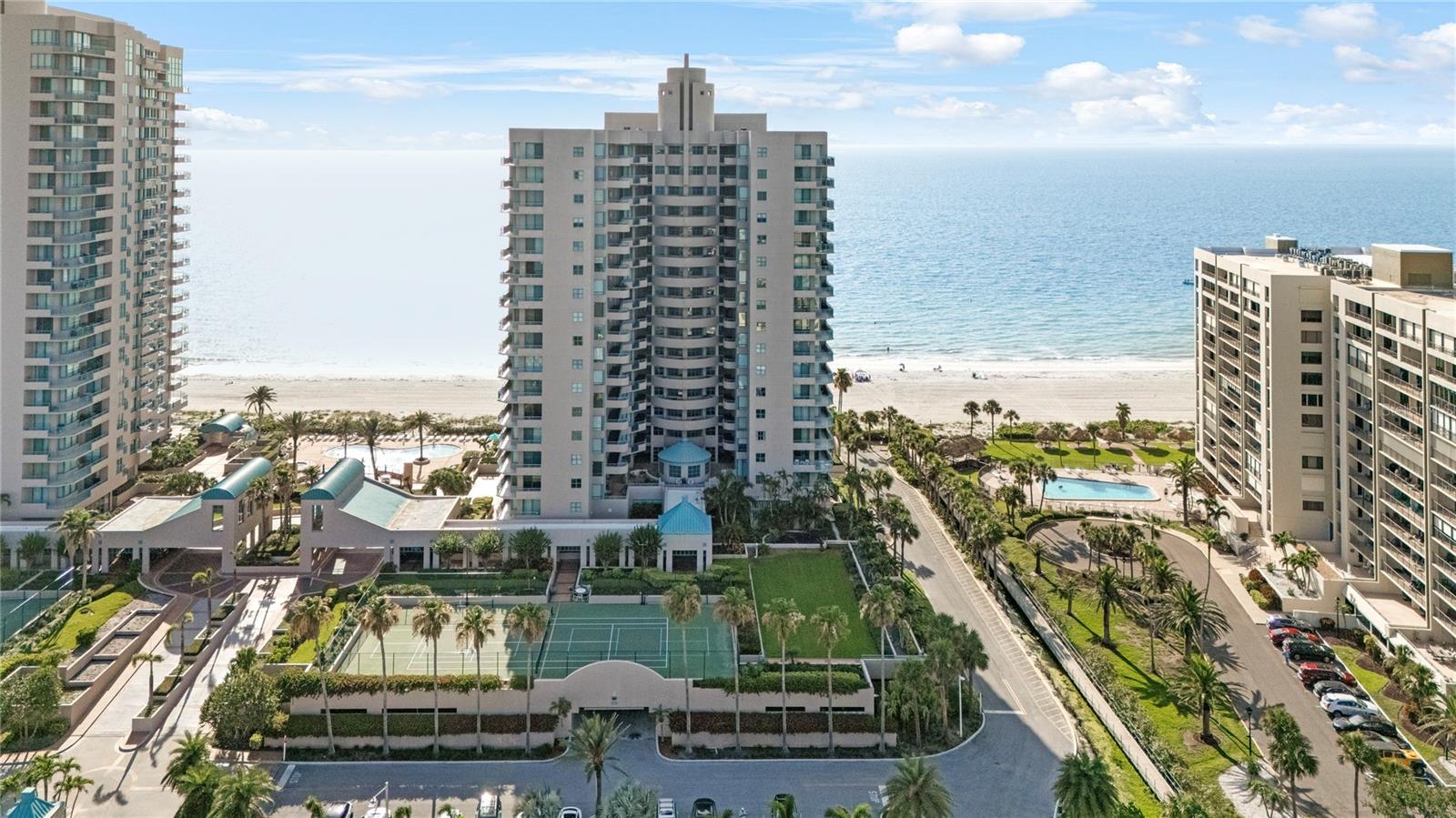 ANNUAL RENTAL. This 2 bedroom 2 bath condo features a 1 car garage. This unit has beach & bay views The Ultimar Condo offers amazing amenities including beach access, 3 pools, lap pool, tennis courts, billiards room, club room, multiple spas, both dry and wet saunas, recently updated fitness center, putting green, club room, 24/7 manned security and more. The primary bedroom features a spa tub, stand-up shower, dual sink vanity and walk-in closet. The wrap-around balcony of the primary bedroom provides amazing views to the east and north This condo is located in Sand Key of Clearwater Beach and is convenient for local restaurants, shopping and activities; and only about a 45 minute commute to Tampa International Airport.