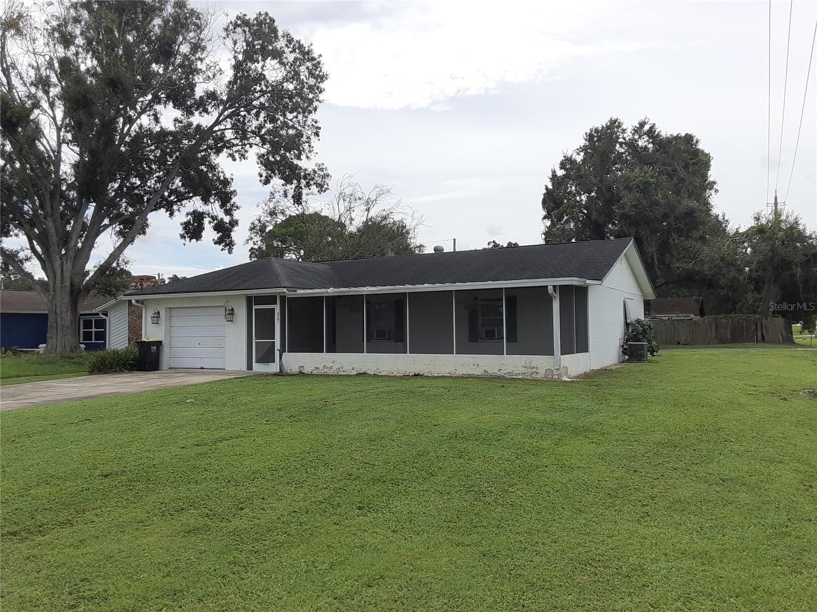 NO HOA - 3 Bed Home on Corner Lot with RV/Boat/Motorhome Covered Parking Pad 23.5' x 35' and 8'4" tall. Living Room with Fireplace and sliding door to back yard, Eat In Kitchen w/Pantry and lots of cabinets. Separate Dining Room. Large Master Bedroom with walk in closet and Walk in shower master bath, large vanity, Ceiling fans in every room. Single Car Attached Garage. Screened Patio 26x10 at front of home.