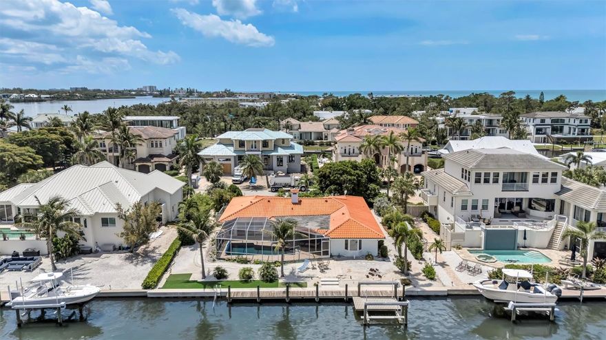 Premier waterfront opportunity in Longboat Key Estates, offering direct canal frontage in one of the island’s most desirable residential enclaves.
Positioned along a quiet interior street, this property offers the opportunity to own or build a custom coastal residence in an area undergoing continued redevelopment and investment potential. Surrounding properties reflect the neighborhood's transformation, with new-construction homes setting a high standard for modern, exclusive waterfront living.
The canal setting provides protected waters  for boating with access to Sarasota Bay, while deeded, private beach access offers the rare combination of boating and beachside lifestyle.
This property offers views of Sarasota Bay and the Intracoastal Waterway directly from your Lanai and dock, featuring a 100 feet of seawall frontage (2022) and a 16,000-pound boat lift (2022). Generous lot dimensions and a tranquil waterfront setting create an exceptional opportunity for boating enthusiasts and the ideal canvas for a thoughtfully designed custom residence. 
As a resident of Longboat Key Estates, a deed-restricted single-family waterfront community, you have deeded access to the Gulf and a private resident-only Tiki within a five-minute walk. 
Enjoy close proximity to Bayfront Park offering pickleball and tennis, kayaking, along within close distance to fine dining, St. Armands Circle, downtown Sarasota, Sarasota International Airport, and Florida’s Gulf Coast, all at your doorstep!