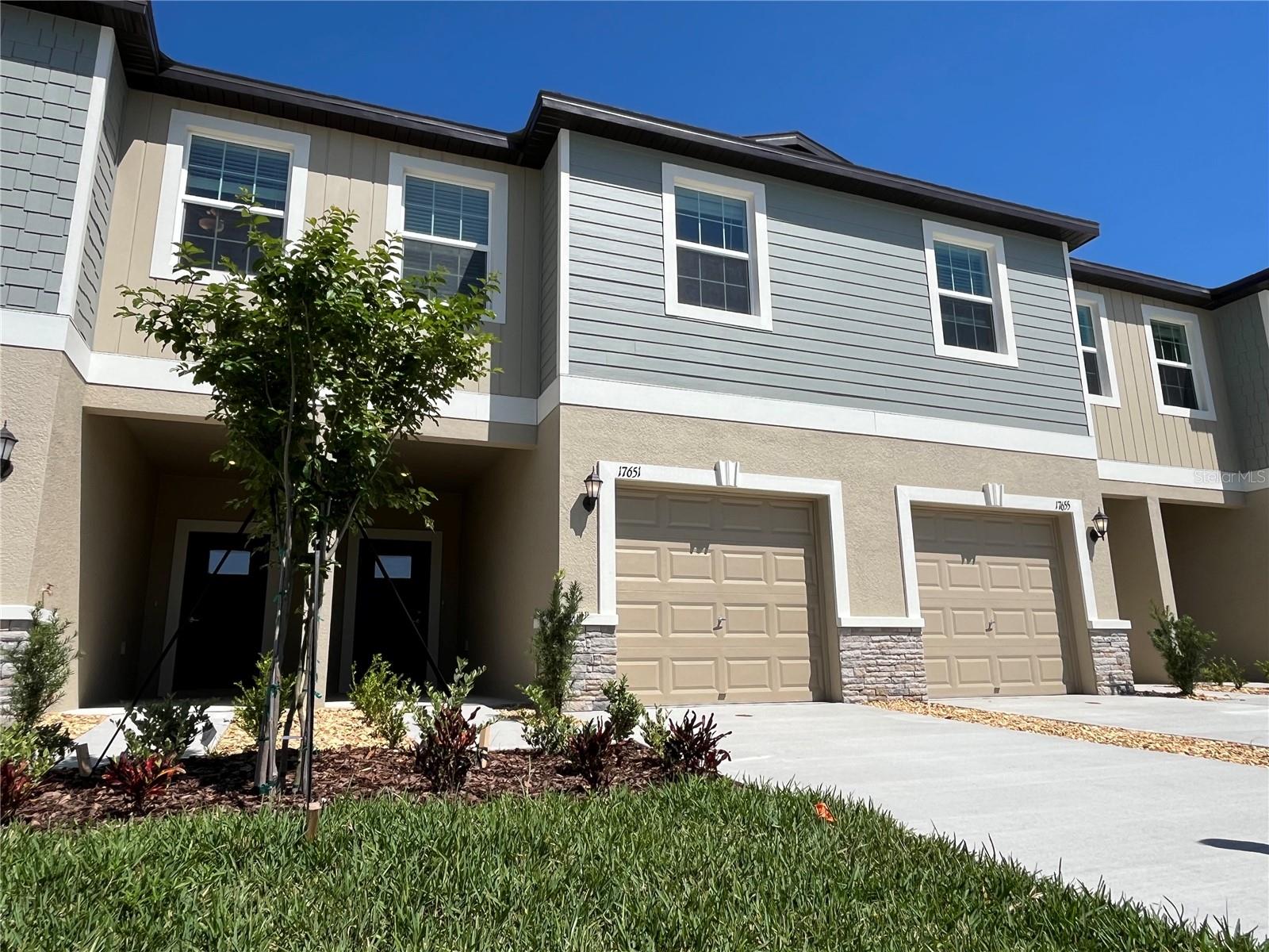 Check out this two-story townhome and enjoy a free-flowing layout among the modern kitchen, Great Room and covered patio. The top floor features the spacious owner’s suite, two secondary bedrooms and a versatile loft space perfect as a home office or additional shared living area. Welcome to Angeline, a new 6,200+ acre masterplan in Land O' Lakes, FL, all residents of Angeline will enjoy exceptional amenities including a community farm, 3,600 acres of green space, up to 100-miles of trails for walking, jogging and biking, and a future recreational lagoon that will offer acres of clear, blue waters with endless beachfront activities. Angeline will also be home to the new state-of-the-art H. Lee Moffitt Cancer Center and Research Institute, Speros FL and STEM (Science, Technology, Engineering and Mathematics) magnet school. Equal Housing Opportunity. Available August 1st!