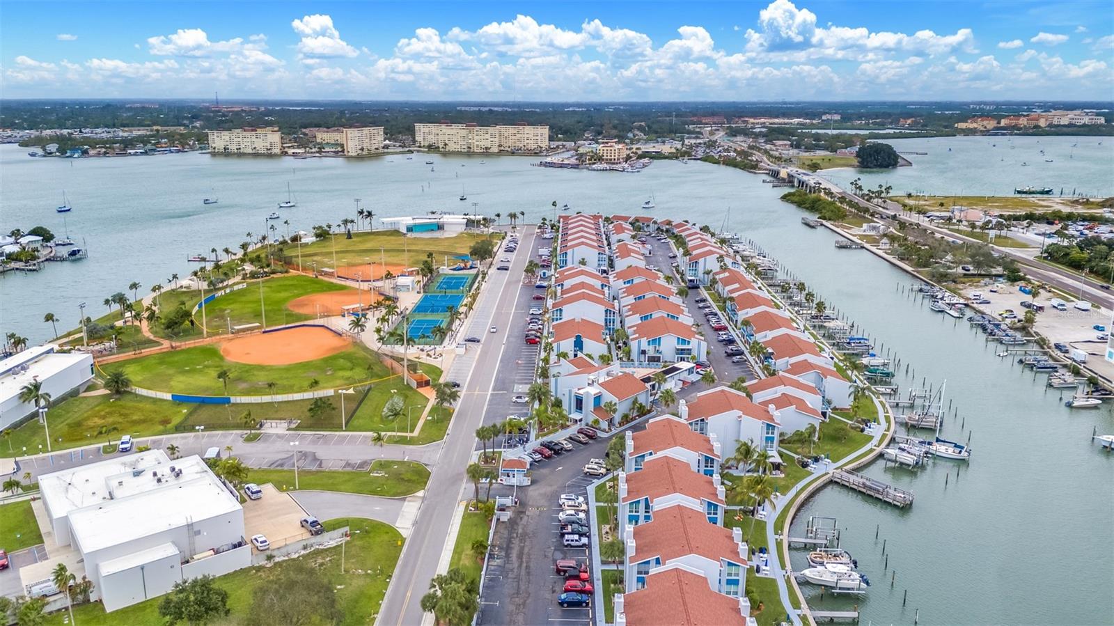 Discover the perfect vacation retreat or investment opportunity in this charming 1-bedroom, 1-bath condo located in a vibrant waterfront community just a 5-minute stroll from the sandy shores of Madeira Beach. Enjoy scenic walks along the Intracoastal Waterway and easy access to restaurants, nightlife, groceries, and shopping. Community amenities include two heated pools, clubhouse, exercise room, hot tub, sauna, billiard room, and four fishing piers with cleaning stations, water, and electric. Situated across from ROC Park and sold as is, this unit remained untouched by Hurricanes Helene and Milton—making it a secure and serene coastal gem. Seller motivated.
