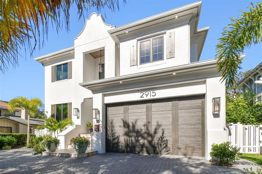 Ideally positioned on a picturesque, sidewalk-lined street in the heart of Bayshore Beautiful, just moments from iconic Bayshore Boulevard, this nearly new custom residence by Taralon Homes delivers refined architectural presence and elevated living throughout. A pavered circular drive, travertine entry steps, and classic Bevolo gas lanterns create a striking arrival. Inside, a grand foyer with soaring ceilings and statement Restoration Hardware lighting introduces an open, light-filled floor plan with 7.5" naturally aged Medallion wide-plank flooring, 8' solid-core interior doors, and level-five smooth drywall. Formal dining with custom built-in cabinetry and a full wet bar featuring Sub-Zero refrigeration and a wine fridge anchors the main level alongside an expansive great room. This room is highlighted by a marble-clad electric fireplace wall and wall-length sliding glass doors that open seamlessly to the outdoors. The chef’s kitchen pairs sculptural design with exceptional function, featuring a dramatic marble waterfall island, dual Thermador refrigerators, a six-burner Thermador gas range with custom hood, galley sink with on-demand filtered water, under-cabinet lighting, and built-in refrigeration drawers. A secondary wet bar with wine refrigeration and ice machine connects directly to the outdoor bar, while a fully equipped scullery with marble counters, additional dishwasher, and walk-in pantry provides discreet convenience. A custom drop zone with built-ins sits just off the garage. Indoor-outdoor living is effortless at the covered lanai with travertine flooring, drop-down screens, recessed lighting, speakers, and a fully appointed alfresco kitchen, overlooking the heated saltwater pool and spa framed by lush landscaping and hardscape. Upstairs, a flexible media lounge with custom cabinetry and wet bar complements generously sized secondary suites with custom closets and marble-finished en-suite baths. The primary suite is a serene retreat with coffered ceilings, dual custom walk-in closets, and a spa-inspired bath featuring a soaking tub, oversized walk-in shower with jewel showerheads, marble vanities with makeup station, towel warmer, and Toto fixtures. Additional highlights include elevator access to all levels, impact-rated windows and doors, spray-foam attic insulation, two natural-gas wall-mounted tankless water heaters, pre-wired low-voltage security and surround sound, Lutron lighting, integrated speakers, owned security cameras, a pool bath with marble waterfall vanity, and a spacious laundry room with built-ins. The two-car garage with lift offers epoxy flooring, rear yard access, and integrated irrigation controls. Enhanced by a Generac whole-home generator and meticulous attention to detail, this exceptional residence offers timeless luxury just steps from Tampa’s most celebrated waterfront promenade.