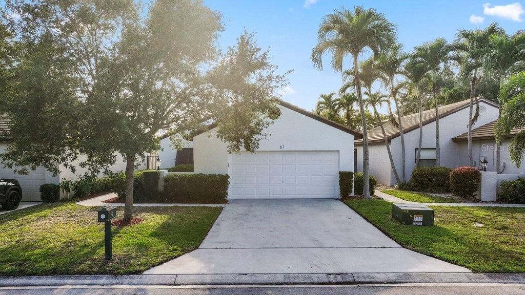 Photo of 61 Ironwood Way N, Palm Beach Gardens, FL 33418 (MLS # O6369004)