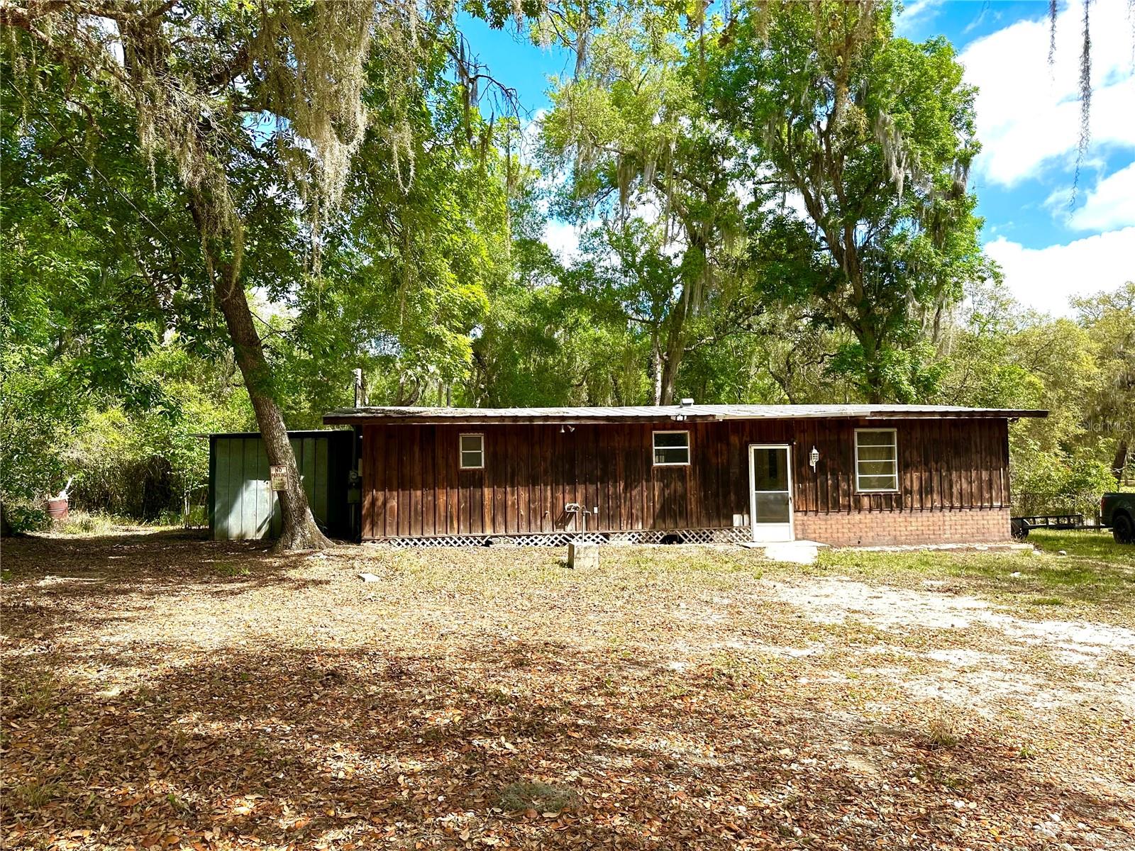 PRICED FOR QUICK SALE! If you like living away from the city, this is your place. At the end of the long and winding road of Gobbler Dr, you’re almost there! Less than two miles from the famous Sleepy Hollow Fish Camp, Boondocks Market, and the Withlapopka Community center. The home needs a lot of attention, but if you have the tools and know-how, you can either live in the home as you remodel or replace the home completely and save yourself from paying impact fees
