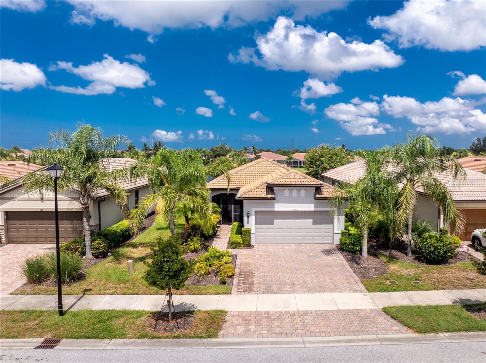 Resort-Style Living with low CDD Fee – Turnkey Furnished Home with a stunning lake view, Oversized Garage, Extended Lanai and driveway, your very own jacuzzi, and WALKING DISTANCE TO THE POOL & CLUBHOUSE!
Upon entering the home through the front screened entry, inside you will discover a beautifully maintained home with a desirable open-concept floor plan designed for both comfort and privacy. Featuring easy to maintain tile flooring throughout the living areas, the home includes a dedicated office/den with French doors, perfect for working from home or as a flex space.
The dining and living areas flow seamlessly into the expansive kitchen, ideal for entertaining, showcasing 42” solid wood cabinetry, granite countertops, a large center island with additional storage, and premium stainless steel appliances and access outside to your paradise featuring an extended paver lanai with western exposure, where you’ll enjoy tranquil lake views and stunning sunsets from your own private 4-seater outdoor Jacuzzi—the perfect space for relaxing or entertaining guests.
The spacious primary suite is a private retreat with vinyl plank flooring, sliding glass doors that lead out to the lanai, plantation shutters and an ensuite bathroom offering dual sink vanity with granite counters, a walk-in shower, and an oversized walk-in closet with custom built-in shelving. A well-appointed guest bedroom is situated on the opposite side of the home featuring vinyl plank flooring, ceiling fan, roomy closet, and is adjacent to a full guest bathroom, ensuring privacy for visitors.
Have peace of mind knowing this home has complete hurricane protection and is located in an "X flood zone".
Islandwalk community is renowned for its vibrant, active lifestyle. Residents enjoy access to two full-service clubhouses, two resort-style pools, 12 pickleball courts, tennis, basketball, bocce courts, a state-of-the-art fitness center, playground, dog park, community garden area, miles of scenic walking and biking trails, and MORE. The community also offers a robust calendar of social events and gatherings, creating a true sense of neighborhood and connection. High speed internet and cable are included in the HOA dues. Venture outside of the community with world class beaches, fishing, golf, dining and shopping, and downtown Wellen Park...all just minutes away!
Don’t miss this opportunity to own a move-in-ready home in one of the most desirable communities in the area. Schedule your private showing today!