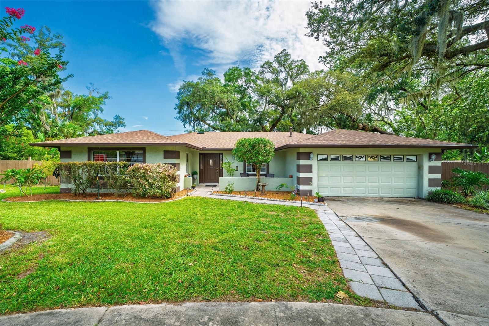 Welcome to your own slice of paradise setting you up for the all time perfect staycation! Situated on an oversized lot on a private cul-de-sac, this beautifully maintained 4-bedroom, 3-bathroom home boasts a backyard made for relaxation and entertaining. Step outside to a lush, park-like setting shaded by mature oaks and enhanced with tropical landscaping, a pergola, grilling area, and a large, sparkling in-ground pool—perfect for weekend get-togethers or peaceful morning swims. The large backyard area allows your family and guests to enjoy a game of volleyball or hone their soccer or lacrosse skills. The screened-in lanai offers year-round outdoor enjoyment, and the spacious paver patio with gazebo is ideal for al fresco dining or lounging in the Florida sun. Inside, enjoy over 2,000 square feet of updated living space with bamboo flooring, an oversized kitchen with stainless steel appliances and dinette area, a formal living/dining room, and a split bedroom layout for added privacy. The primary suite features an en-suite bath with a separate vanity, walk-in closet, and access to the lanai and pool area. Three additional and spacious bedrooms on the opposite side of the house offer plenty of privacy and space to rest and unwind. Both guest bathrooms have been tastefully remodeled. The hall bath includes a new tub/shower and single vanity, while the pool bath showcases a designer walk-in shower and quartz-top vanity. An easy hop onto the Seminole Wekiva Trail, enjoy 14 miles of biking and walking. Located just minutes from I-4 and top-rated schools, this home blends tranquility, space, and convenience—don’t miss your chance to live in one of the area's most established neighborhoods!
ROOF - 2021 HVAC - 2017