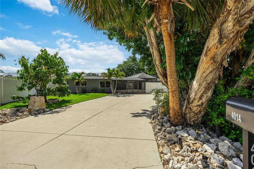 Welcome to 4014 Radnor Place—a beautifully updated Sarasota home that combines clean design, thoughtful upgrades, and easy indoor-outdoor living, all with no HOA restrictions.
Right away, you’ll notice the attention to detail. The home features a brand-new roof (2026), hurricane-impact windows and doors throughout, and a fully renovated interior that feels cohesive without being overdone. Tile plank flooring runs throughout, paired with 1x baseboards and casing for a clean, finished look. The kitchen has been updated with quartz countertops and flows seamlessly into the main living areas, while the bathrooms have also been tastefully renovated with quality finishes. One of the guest rooms also features a built-in Murphy bed, offering flexibility for guests, a home office, or additional living space.
Out back is where this home truly shines. The backyard has been thoughtfully designed as a private retreat with a saltwater pool, pool heater, and a gorgeous Shellcrete pool deck—perfect for relaxing or entertaining year-round. The picture-frame pool cage provides unobstructed views of the outdoor space, while portions of the backyard fencing reach up to 8 feet for additional privacy before transitioning to 6 feet around the remainder of the yard. Mature Areca palms have also been added to enhance the tropical feel and create even more seclusion.
A full outdoor bathroom is a standout feature, making pool days even more convenient while helping keep traffic out of the main house. There’s also ample extra storage, including a large shipping container that offers excellent space for tools, equipment, hobbies, or seasonal items.
The exterior has been designed with both functionality and low maintenance in mind. The oversized concrete driveway offers plenty of room for boats, RVs, trailers, or additional parking—something increasingly hard to find in Sarasota. The front yard features fresh St. Augustine grass along with updated landscaping, while the backyard is finished with astroturf for a clean, green look year-round without the upkeep.
It’s one of those homes that simply feels easy the moment you walk in—everything has already been done and is ready to enjoy. Centrally located with quick access to shopping, dining, and the Legacy Trail for evening walks, bike rides, or exercise, this is a true move-in ready Sarasota property with quality upgrades throughout.