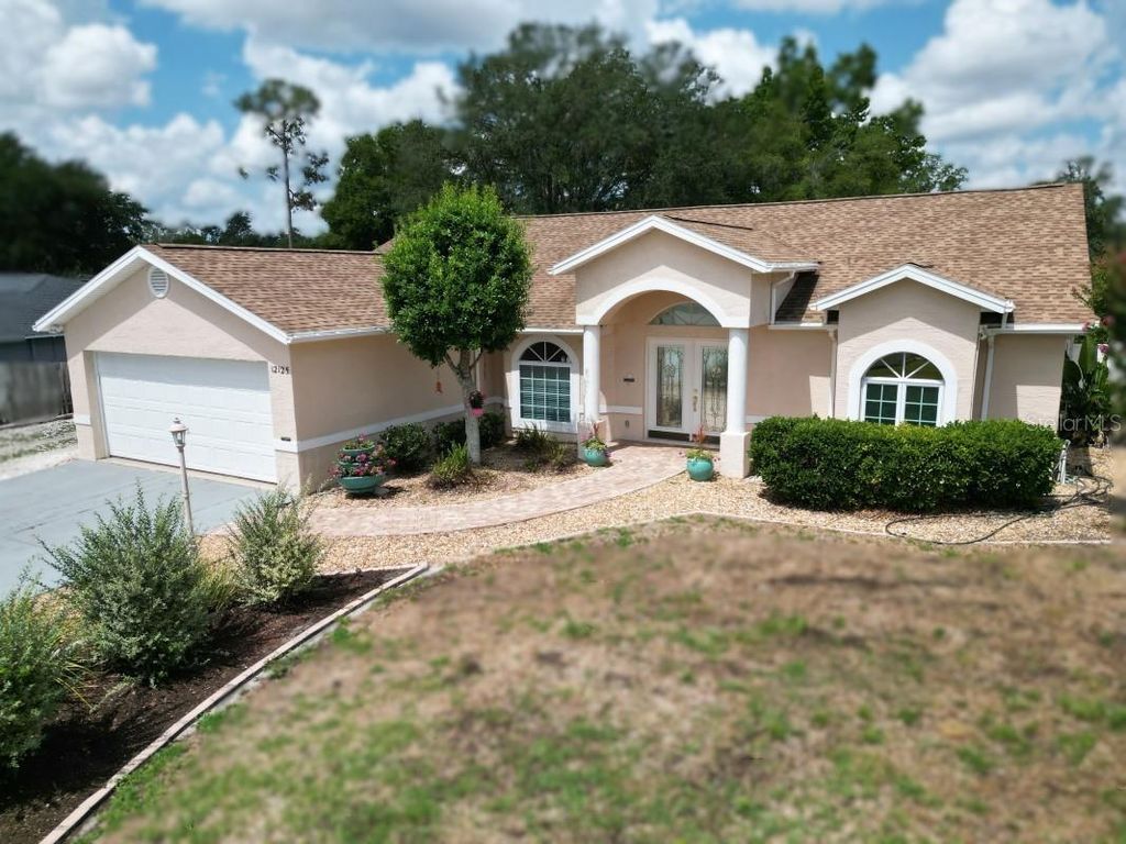Photo of 12125 Knotty Pine Loop, San Antonio, FL 33576 (MLS # TB8509654)