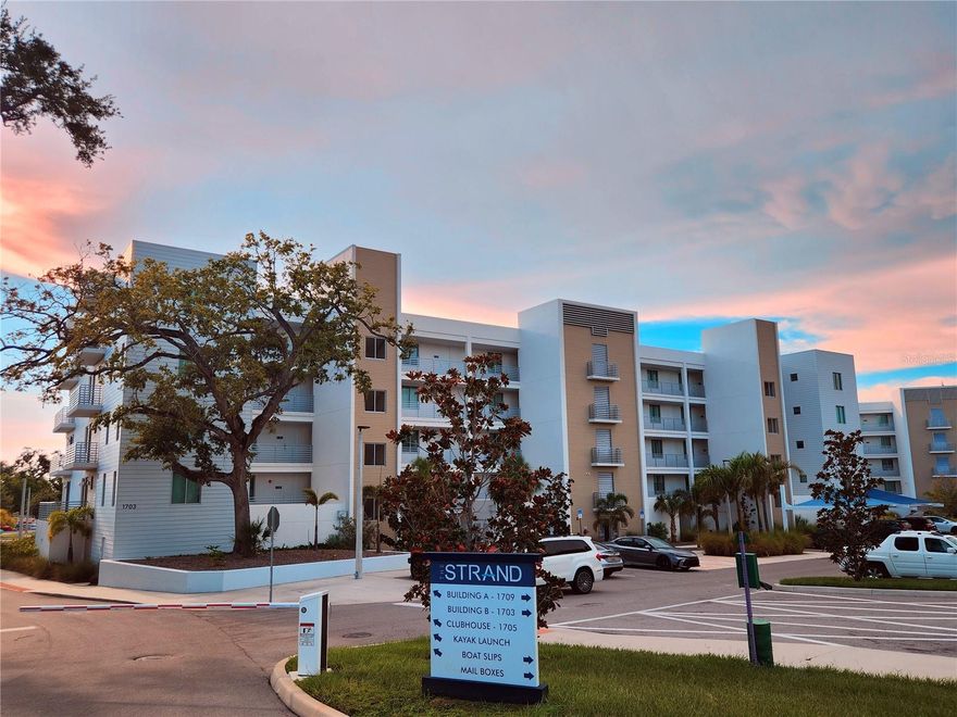 Welcome Boaters! This is your opportunity to own a top floor unit with peekaboo bay views and your own private dock at The Strand! Unit 507 offers the rare opportunity of an included deeded 32.5ft private dock with water and electric. After boating you can enjoy a beautiful sunset on your covered terrace with peekaboo bay and pool views. The large kitchen quartz counters and open floor plan make this condo great for entertaining. The primary suite offers a large walk-in shower and walk-in closet. The large den has a closet, making it a perfect bedroom for guests. The Strand offers a private dog park, floating kayak launch, pool and spa, gym, fire pit, and gas grills. All of this is located a short distance to 3 waterfront public parks, a 2 minute drive to downtown for weekend farmer's markets or an evening opera show. Lido Key beach is only 5 miles and the world famous Siesta Key is only 8 miles from your private garage parking spot.