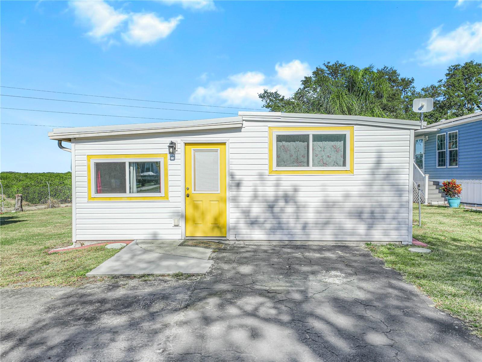 If you are looking for affordable retirement living, or a place to enjoy the winter with lots of activities, you just found it! This two bedroom newly remodeled and fully furnished home is located in the 55+ community of Saddlebag Lake Resort, where you OWN the land, no more paying lot rent. The home has laminate flooring throughout so it's easy to keep clean. You'll love the kitchen, with it's many cabinets and lots of counter space, and there's even an island for extra prep work and for sitting at to enjoy a meal. Upstairs you'll find two good size bedrooms, a nicely redone bathroom and loads of storage space. Outside you'll see the driveway is large enough to accommodate two vehicles, and out back there's a patio for grilling and a shed for all your tools. The home backs up to the orange grove, so you will have no rear neighbors, and is situated near the back of the resort so the traffic is minimal. Pets are welcome here, you'll be close to the dog park so you can let your furry family members run around. Enjoy all the resort has to offer, including the heated community pool, hot tub and saunas, tennis and pickle ball courts, shuffleboard and horse shoes, the rec room with pool tables and fitness equipment, boating and fishing on Saddlebag Lake, the clubhouse with planned activities and more - this is truly a must see! Call now for your private tour!