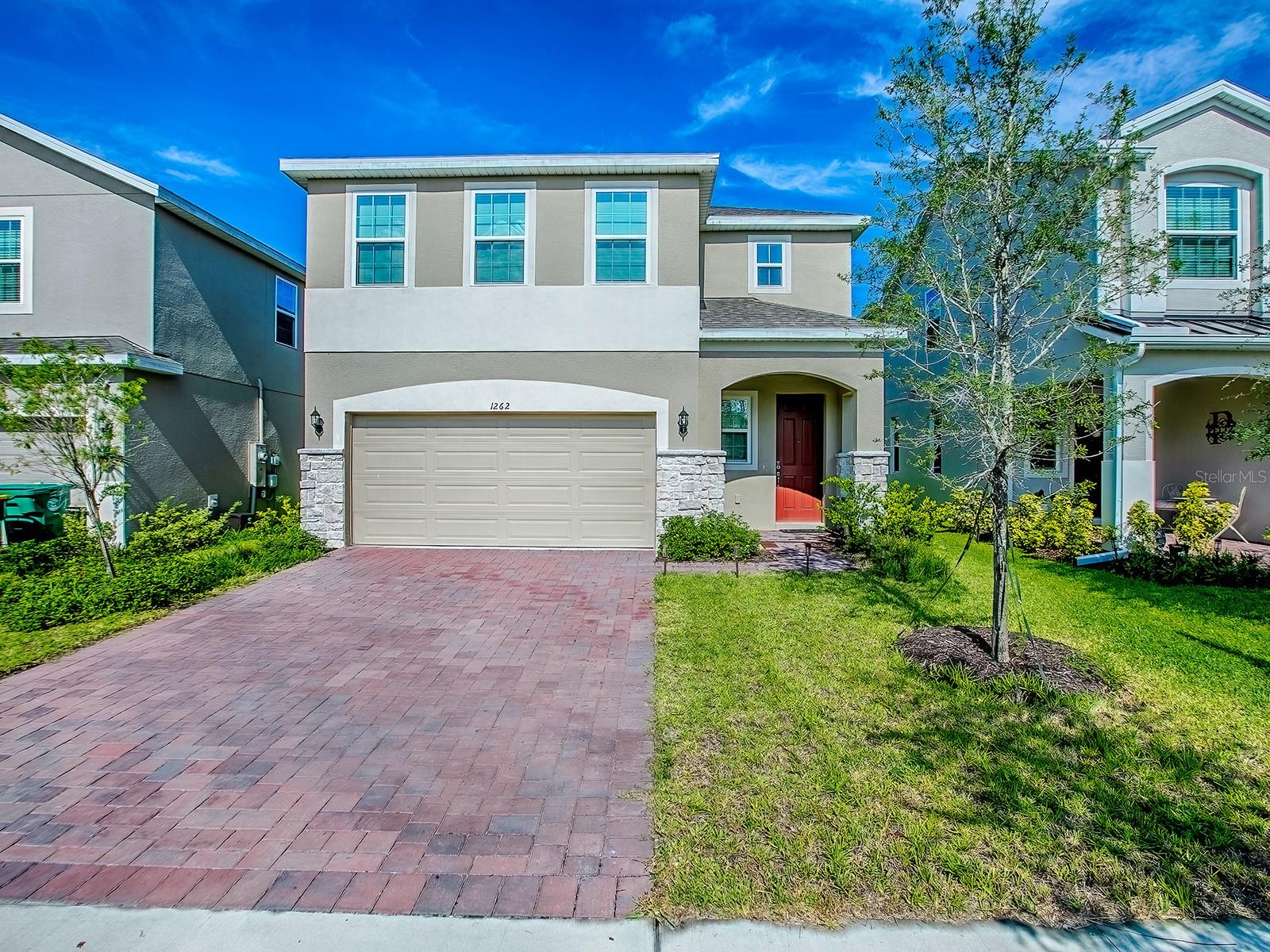 Schedule your showing now to see this well-appointed home, completed in 2024, featuring 4 Bedrooms, 2.5 Baths, a spacious open concept Living Room, Dining Room & Kitchen layout with high ceilings and lovely modern amenities. The 1st floor layout includes a large Kitchen with Island that allows for ample food prep, seating and storage. A bright glass slider opens to the Lanai and Yard. The 1/2 Bath, a Den with French Doors for privacy and direct access to the spacious Garage round out the first floor. The second floor includes a large Bonus Room that could be used as a Family Room, Playroom or Office, along with three good sized Bedrooms with large closets, a Full Private Bath with dual sinks, and Tub with Shower, plus a separate Laundry Room. The Primary Bedroom with En-suite Bathroom and walk-in closet is opposite the additional bedrooms offering more privacy. This very popular and expanding community welcomes you - no need for the long wait of new construction – move right in! A Community Pool and Club House are being completed soon. The Seller very much loves his home but is only moving due to a work relocation.