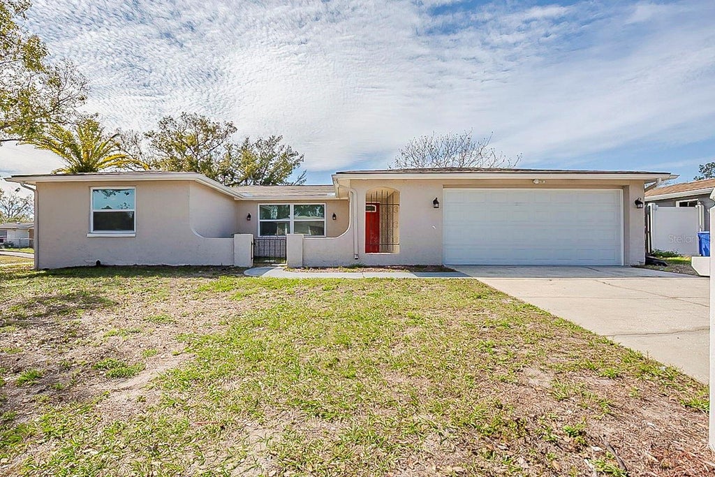 Photo of 9811 Rainbow Lane, Port Richey, FL 34668 (MLS # O6420955)