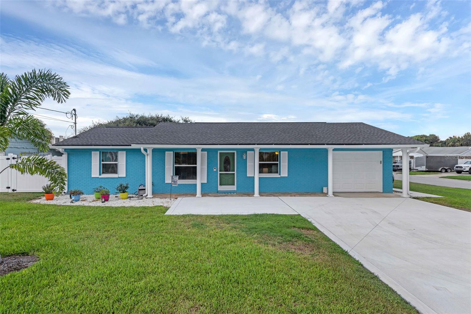 Welcome to 825 E 27th Avenue - Move-In Ready Beachside Home just two blocks from 27th Ave Beachfront Park! This upgraded corner-lot home is steps from the ocean and comes partially furnished and features a flexible bonus room perfect for a home office, guest space, or hobby room. Major upgrades include a new saltwater pool with concrete paver deck, whole-house Generac generator, vinyl privacy fence, oversized driveway, LVP flooring throughout, new washer, dryer & dishwasher, and extra attic insulation for improved efficiency. Freshly painted inside and out with a newer roof (2023). The spacious layout includes a family room with a wood-burning fireplace, perfect for relaxing or entertaining. The galley kitchen offers granite counters, stainless appliances, gas cooktop & breakfast bar. French doors lead to a screened lanai on the west side of home offering stunning sunset views, and to a gorgeous saltwater pool on the oceanside for the ultimate in outdoor living. The split-bedroom layout provides privacy and function. This large corner lot offers plenty of room for boat or RV parking! Close to Flagler Ave & Canal St shops, dining, festivals, live music, golf, and the drive-free beach. Ride to Cape Canaveral Nat’l Seashore or enjoy sunrise walks. NSB offers laid-back charm with upscale coastal living!