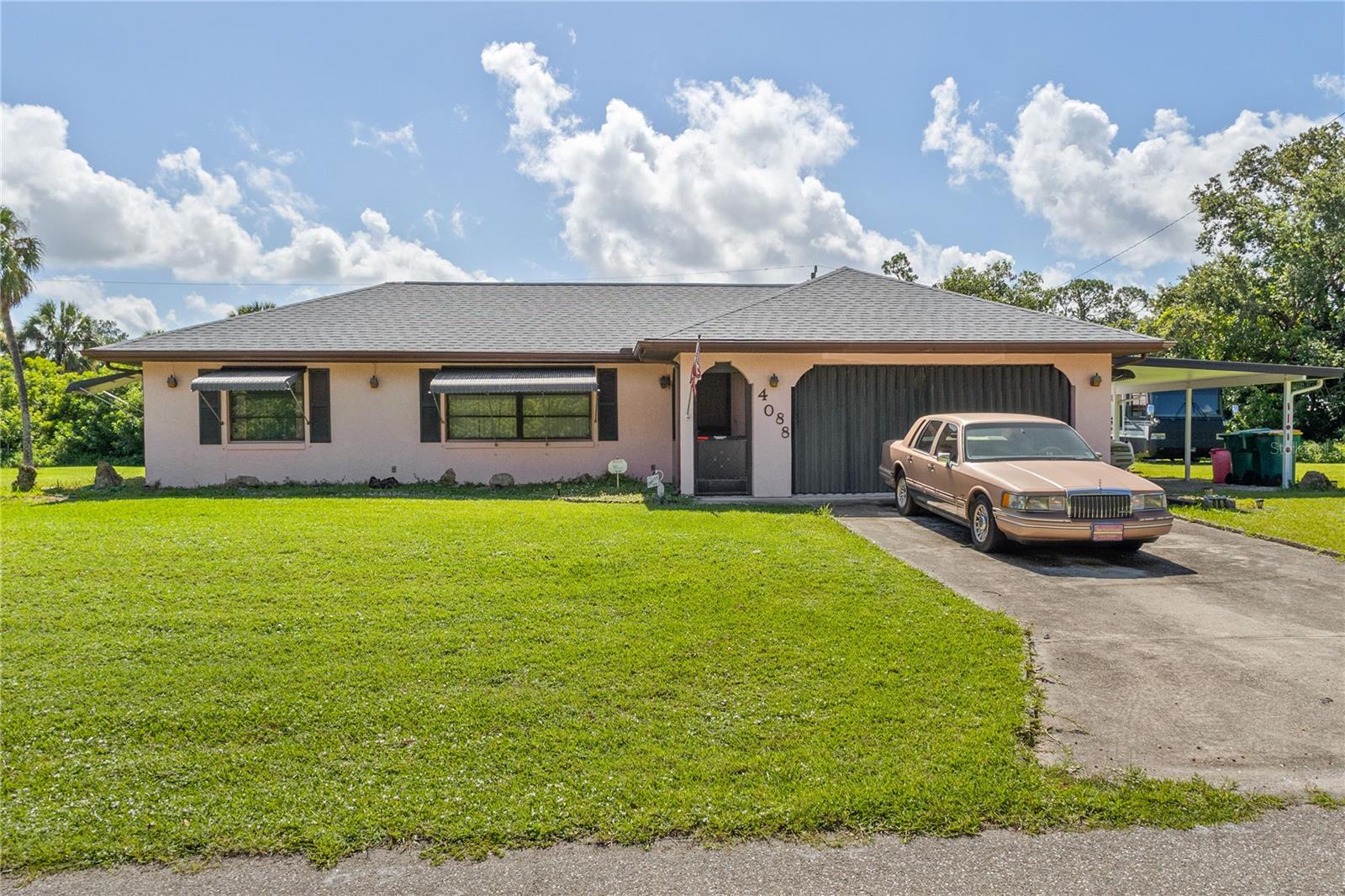 LOCATION, LOCATION, LOCATION!!! Looking for a nice starter home on a DOUBLE LOT, just a short drive to boat ramps and the beach?? Welcome to 4088 Durant Street! Being OFFERED BELOW ASSESSED VALUE, this meticulously cared for and well loved ORIGINAL OWNER, 2 bedroom, 2 bath POOL home is just perfect for new owners with a little imagination. Great eat-in kitchen and separate dining room for special occasions. The garage conversion, with separate entry, currently be used as a family room can easily BE adapted to a 3rd bedroom, or rental space. The split floor plan provides plenty of privacy for the family, with the Primary bedroom having an en suite bathroom & walk-in closet. Inside utility laundry room. Step outside into a 34x31 space perfect for gathering with family & friends for weekend BBQs & Holidays the "Florida Way" on the covered, screened lanai. Lots of room for BOAT, RV, WORK VEHICLES etc on the cleared double lot with TWO storage sheds and one-car carport! Hurricane protection on windows & doors, ROOF 2022. Underground utilities recently installed, and sewer coming soon. Two boat ramps just a short drive away to either Spring Lake or Port Charlotte Beach Complex!! BOTH lead out to Charlotte Harbor & the Gulf waters!! The pristine Gulf beaches, nightlife, Golf, Pickle Ball, and your new Florida lifestyle await you just a short drive to Ft Myers, Venice & Sarasota! This lovely private oasis is a diamond in the rough for someone with the vision of its potential. Make your appointment to see this special property soon!