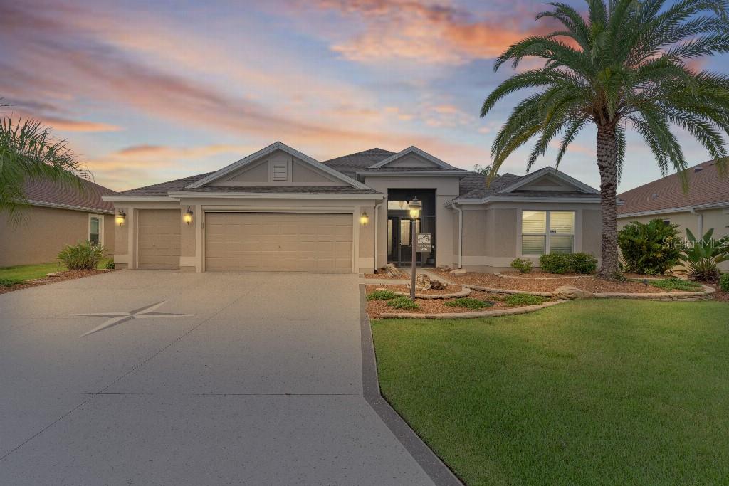 This expanded designer LAUREL OAK home features 3 bedrooms and 2 bathrooms (both with walk
in showers) offering over 2400+ sq ft of living space. Located on a highly desired preserve lot in The
Village of Dunedin. The front screened front entry with double sided paned door leads to this special
home. The open concept layout features ceiling fans in every room, custom lighting, 7” crown
molding throughout entire house, plantation shutters and undercounter lighting. The living room
features a custom-made entertainment system and overhead stereo system. The kitchen features
granite countertops, expanded cabinetry and tile work, pantry and cabinets with pull out drawers,
stainless steel appliance with a GAS range top, not normally found in this Village. Wine cooler for
entertaining. The home features 24” tile on the diagonal throughout. Master bath features vaulted
ceiling, ceiling fan, walk-in closet with built-in shelving and a spacious en-suite bathroom, roman
shower, dual vanities with granite countertops and unique ceiling fan. The two-car garage + golf cart
has an epoxy floor, ceiling fan, Mitsubishi mini split, remote controlled garage screen, storage
cabinets and slat wall for extra storage, and pull-down attic stairs. Driveway is also custom designed
and textured. New roof in August 2025, freshly painted exterior in July 2025 and new water heater in
2024. Turn key offers will be considered.