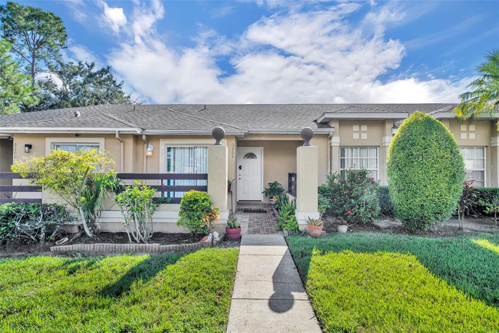 Exceptional opportunity in Raintree Park Townhouse, a desirable community in Kissimmee, Florida. This meticulously maintained 2-bedroom, 2-full bathroom townhouse, featuring an enclosed rear porch, offers a versatile living space ideal for investors, first-time homebuyers, or those seeking to downsize. Located conveniently by the community entrance and just a short walk from the refreshing community pool, this property combines accessibility with leisure. Step inside to a fully renovated kitchen, showcasing modern finishes and functionality. The entire home boasts new flooring, providing a fresh and cohesive aesthetic. Comfort is assured year-round with a brand-new HVAC unit installed within the last year. The rear porch has been professionally enclosed, extending the living area with an integrated AC vent for added comfort; this space can easily be reverted to an open sunroom if preferred, offering flexibility to suit your lifestyle. Living in Raintree Park Townhouse provides true convenience, with close proximity to Orange County and various shopping centers, ensuring all your daily needs and entertainment options are within easy reach. A significant advantage of this community is the low-maintenance lifestyle, as the Homeowners Association (HOA) covers all exterior maintenance, contributing to minimal homeowner's insurance costs and making this property an even more attractive and affordable option. This townhouse represents a compelling value proposition in a competitive market, offering modern updates, community amenities, and a prime location. It is an excellent choice for those seeking a move-in ready home with long-term appeal.