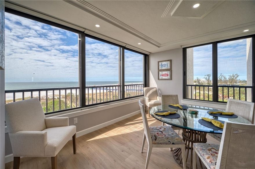 Discover the ultimate coastal lifestyle in this elegant 3 Bed/2 Bath condo, perfectly situated on the top floor of the beachfront F building at Gulf & Bay Club with breathtaking views of Siesta Key Beach. Spanning over 2000 square feet, this corner unit has been completely renovated and is offered turnkey furnished, ready for immediate enjoyment. Step inside to find sleek porcelain tile floors, recessed ceiling lighting, and an open floor plan that seamlessly blends elegance with functionality. The chef's kitchen is a showstopper, featuring stainless steel appliances, quartz countertops, solid wood cabinets with soft-close doors and drawers, a breakfast bar, a spacious island, and a dry bar with a 2-drawer beverage fridge. The beach facing windows are all impact glass, and there are remote-controlled shades on every window to complement the natural light. The spacious master suite is a private oasis with a spa-like bathroom boasting dual sinks and a stunning blue granite walk-in shower. There is plenty of storage with a linen closet and a walk-in closet with built-ins. Two additional bedrooms provide ample comfort for your guests. Additional highlights include a foyer with a coat closet and a bench seat with additional storage. You will appreciate the convenience of your own laundry room. This exceptional condo offers the perfect combination of luxury, comfort, and unbeatable coastal living. Nestled on 32 lushly landscaped acres, Gulf & Bay Club offers the ultimate resort-style living. With 800 feet of private beach, you’ll enjoy breathtaking views, serene sunsets, and direct access to your own slice of paradise. This vibrant gated complex is designed for relaxation and recreation. Amenities include 3 sparkling swimming pools, a rejuvenating indoor hot tub, several dry saunas, pickleball, tennis, basketball, racquetball, and shuffleboard courts. There are two clubhouses, a well-appointed fitness center, multiple BBQ areas, Electric Vehicle charging stations, and a car wash area. A guest suite, available exclusively for owners can be reserved for visiting family and friends. Just a short stroll or free shuttle ride to the Siesta Key Village restaurants and shops or a short drive to downtown Sarasota, this community combines tranquil coastal living with easy access to urban conveniences. Whether you’re relaxing on the beach or staying active on the courts, Gulf & Bay Club truly has something for everyone. It is more than just a home—it’s a lifestyle.