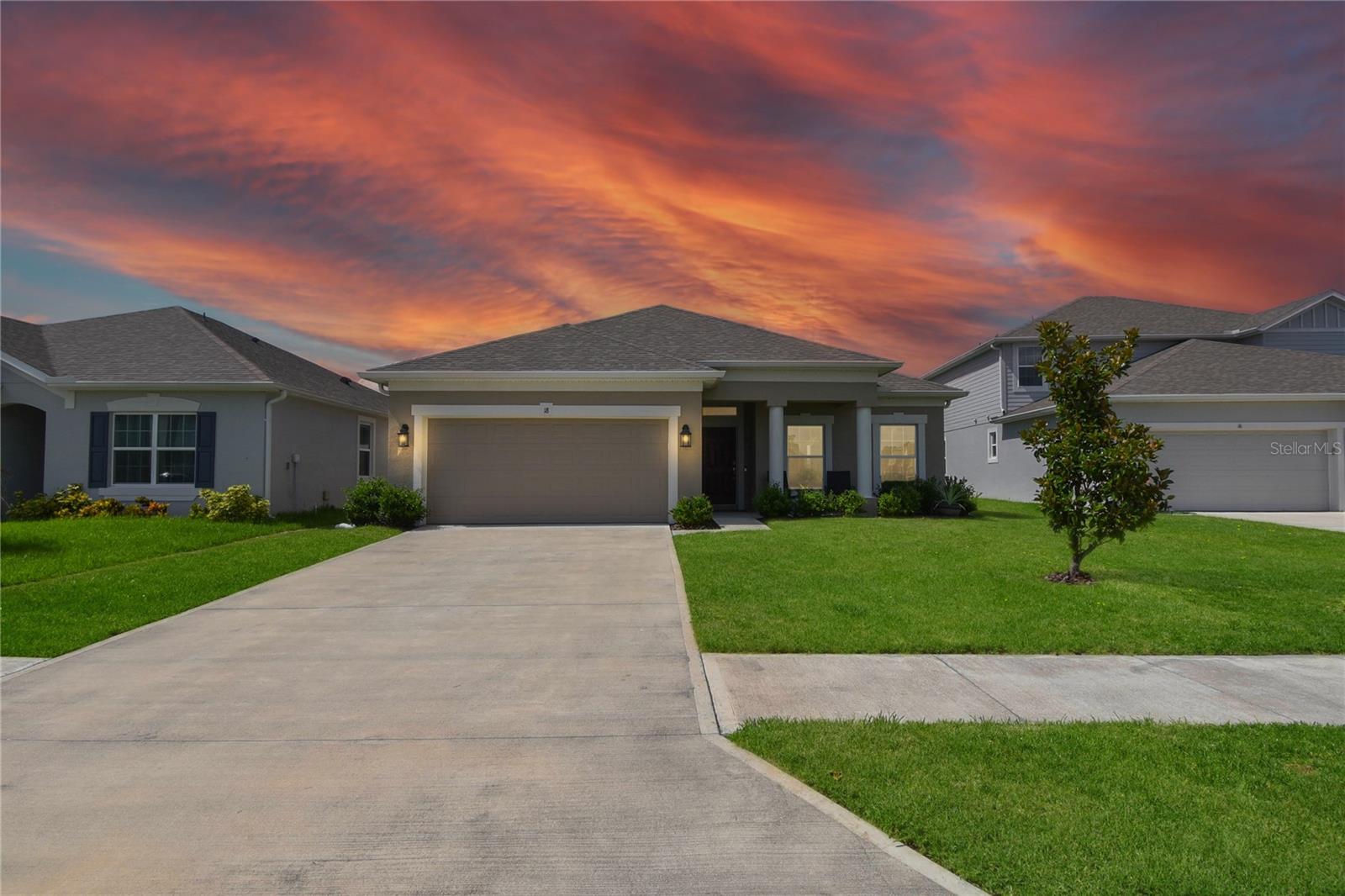 Welcome to 18 Oakleaf Way, Palm Coast, FL 32137?Built in 2023 | 4 Bedrooms | 3 Bathrooms | 1,973 Sq Ft
This nearly-new Holiday Builders home offers the perfect blend of style, comfort, and convenience—all just minutes from the beach. Designed with an open-concept layout and packed with thoughtful upgrades, it’s truly move-in ready.
Step inside to find a modern kitchen with stainless steel appliances, a spacious pantry, and engineered flooring throughout the main living areas. The generously sized bedrooms offer flexibility for families, guests, or home offices. The primary suite includes dual sinks, a walk-in closet, and a walk-in shower for added luxury.
Included in the sale are the washer and dryer, wall-mounted TVs, an entertainment center, and even the kitchen table. Every window treatment stays, and the extras don’t stop there—the 2-car garage comes with shelving, a refrigerator, lawn equipment, and a Club Car golf cart.
Enjoy Florida living outdoors with a fully fenced backyard, screened-in back porch, and upgraded paver patio—ideal for entertaining or relaxing in peace. The low HOA and CDD fees provide access to a community pool, clubhouse, and scenic sidewalks.
This home comes with peace of mind thanks to its solid concrete block construction, a 10-year builder warranty, and transferable HVAC and termite warranties.
Located just 14 miles from the beach, 5 miles from I-95, and 7 miles from local shopping and dining, this home is ready for you to move in and start living the good life.
Schedule your showing today—homes like this don’t stay on the market for long!