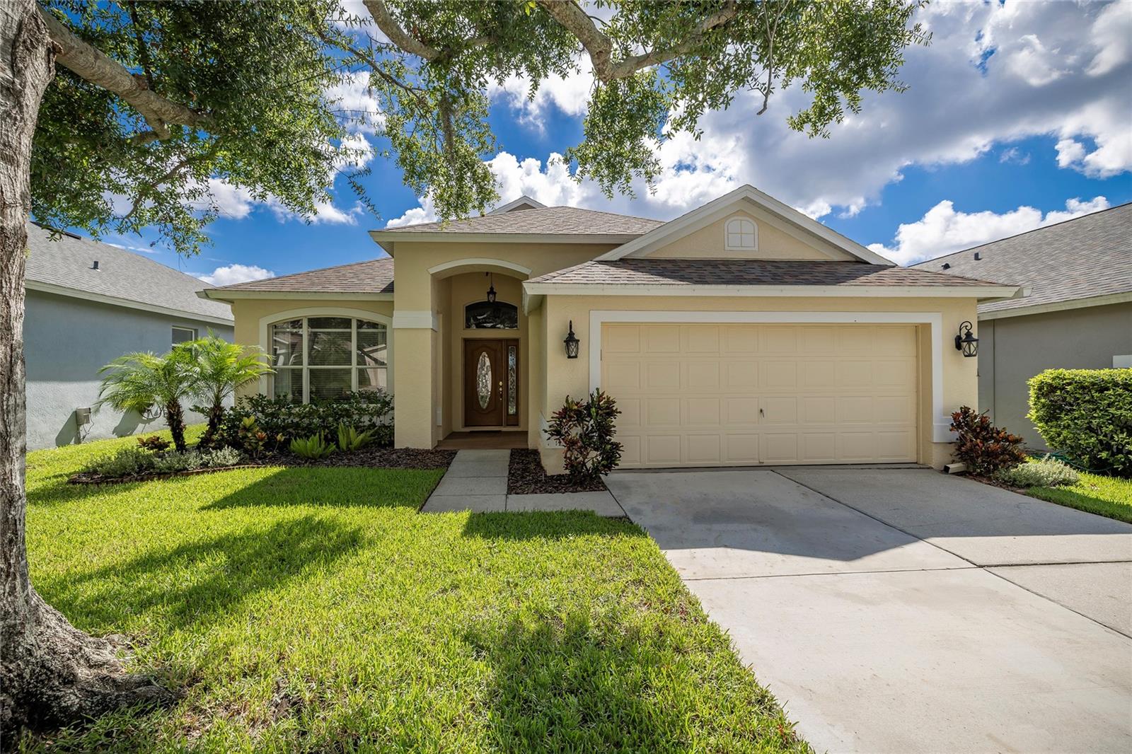 Looking for a home in the highly sought after Westchase area, you will need to check out this beautiful 4-bedroom, 2 bathrooms, 2-stall garage home. Low HOA and NO Flood zone. As you enter this home you will be amazed by the beautiful water view of the pond in the back of the home. The breathtaking view is awesome. You will notice right away the home has new luxury vinyl throughout the entire home. This home has an open floor plan with the kitchen opening to the dining room/family room. Great space to entertain family and friends. There is also a breakfast area joining the kitchen with lots of natural sunlight coming in through all the windows. There is inside laundry closet off the kitchen. The split bedroom plan offers a primary bedroom on one side of the home with a newly remodeled primary ensuite bathroom. All the upgrades make this bathroom one you won’t want to miss. There are two other bedrooms and a bathroom on the other side of the home. These make great kids' bedrooms or for in-laws or guests to stay in. The fourth bedroom can be used as an additional guest room or an office and is located at the front of the home. When you're ready to relax, you can step out into the screened in lanai and enjoy the pond views or sit in the spa and enjoy the peacefulness. Roof 2019, Water Heater 2022, AC 2025. Westchase is a golf community featuring West Park Village – a town center with restaurant and retail establishments. It includes community pools, tennis/pickleball courts, two parks/playgrounds and miles of sidewalk trails. Easy access to the Veteran’s Expressway, Tampa International Airport, the Westshore Business District, and Pinellas County Beaches.