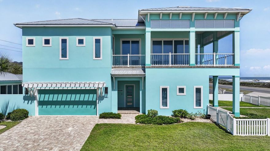 Private Flagler Beach oceanfront retreat with sunrise terraces, walkable coastal luxury in a boutique beach town! 

Experience the pinnacle of coastal luxury in this stunning oceanfront residence, expertly built in 2021 by Intracoastal Homes.

Designed to capture breathtaking views of the Atlantic Ocean, this exceptional property offers 4 bedrooms, 3.5 baths, and a private casita—perfectly blending sophisticated design with effortless coastal living.

The second-floor primary suite is a true retreat, thoughtfully positioned to maximize panoramic ocean views. Enjoy direct access to an expansive balcony, a custom walk-in closet with built-ins, and a spa-inspired bath featuring a walk-in shower with bench seating, dual shower heads, double vanities, and a private water closet with bidet.

At the heart of the home, the chef’s kitchen is designed for both function and style, showcasing premium Monogram Appliances including a 6-burner gas range with griddle and double ovens, side-by-side refrigerator, dual refrigerator drawers, microwave, farmhouse sink, and a spacious walk-in pantry with beverage fridge. The oversized island flows seamlessly into the open living and dining areas—ideal for entertaining.

The main living space is nothing short of spectacular, featuring a zero-corner sliding glass wall that disappears to create a seamless indoor-outdoor experience, opening to over 600 square feet of oceanfront balcony space—perfect for enjoying sunrise views and coastal breezes.

The first floor offers three generously sized guest bedrooms, two with ocean views and direct patio access. A full guest bath with exterior entry provides convenience after beach days, along with a dedicated laundry area for added functionality. On the west side of the home, a private outdoor oasis awaits—complete with a heated and chilled saltwater pool, built-in grill, bar area, and a detached casita featuring a full bath, kitchenette, and secure storage/safe room.

Luxury finishes are evident throughout, including LVP cork-backed flooring, porcelain tile in baths, custom ceiling beams, wide baseboards, designer cabinetry, designer tile, and high-end lighting fixtures. Whole house water purifier for fresh crisp clean water from anywhere in the home, whole house gas powered generator along with underground electrical connections add peace of mind in inclimate weather. 

For the modern homeowner, this residence is equipped with a full smart home system powered by Control4, managing audio, video, TVs, surround sound, indoor and outdoor speakers, electric blinds, garage doors, thermostats, door locks, pool systems, and Lutron lighting.

Additional highlights include two separate garages—one two-car garage and one single-car garage—both with split AC systems, natural gas service, and the inclusion of all mounted TVs, built-in audio components, and transferable manufacturer warranties.

This is a rare opportunity to own a turnkey oceanfront masterpiece where luxury, technology, and coastal elegance converge. Littoral rights will convey with the sale of this property, public beach walkover is located to the right of the littoral property. 

Nestled along Florida’s scenic Atlantic coastline, Flagler Beach offers the perfect blend of Old Florida charm and relaxed coastal living. Positioned between St. Augustine and Daytona Beach, this hidden gem is known for its uncrowded shoreline, friendly community, and laid-back beach town vibe.