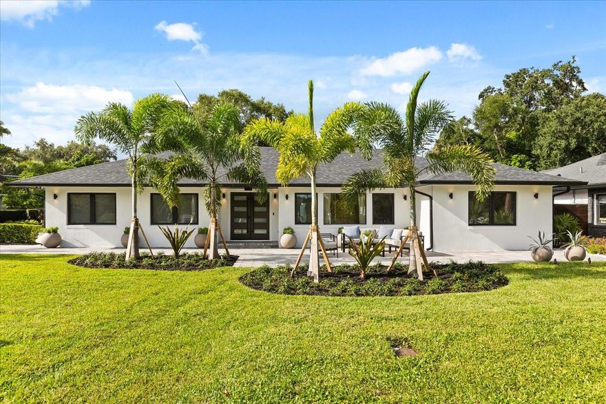 Perfectly situated on a spacious corner lot overlooking beautiful Lake Davis, this single-story pool home offers an open layout that flows seamlessly from the living, dining, and kitchen areas to the outdoor spaces.
The primary suite features a spa-inspired bathroom and a walk-in closet, while 10-foot ceilings in the living area and a stunning chef’s kitchen with top-of-the-line appliances, custom cabinetry, and an oversized island create an inviting atmosphere for everyday living and entertaining.
Outside, the backyard feels like a private retreat with a resort-style pool, lush landscaping, and a full outdoor summer kitchen equipped with a large grill, refrigerator, freezer, oversized sink, and exhaust fan.
Thoughtful details throughout include a whole-home water filtration system, instant hot-water faucet, HVAC scent system, LED lighting, and a custom built-in wall unit. Beautiful landscaping completes the home’s timeless curb appeal.
Located in one of Orlando’s most desirable neighborhoods, you’re minutes from Downtown, SODO, neighborhood parks, and top-rated Blankner and Boone schools—offering the perfect balance of lakefront serenity and city living.