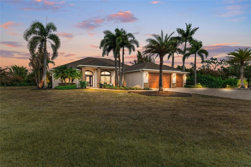 Private 5 acre estate in Punta Gorda offering exceptional space, privacy, and versatility. The beautifully landscaped grounds represent a high end investment that would take years to replicate, with mature tropical plantings and towering bamboo creating a natural privacy barrier and an incredible estate setting. A beautiful freshwater pond located at the front of the property enhances the setting and offers the opportunity for a fountain feature as well as recreational fishing. Over 4,000 square feet of pavers surround the home and outdoor areas, including a large rear patio with a fire pit perfect for relaxing or entertaining.

A standout feature of the property is the impressive 2,000 square foot metal building. Ideal for collectors, car enthusiasts, boat storage, a mechanic shop, or operating a home based business, this massive structure offers incredible flexibility. The building also includes an office space that can remain for convenience or easily be removed to create additional open workspace.

Built in 2015, this well maintained 4 bedroom, 3 bathroom home features impact windows and doors, real wood plantation shutters, an insulated foam roof for energy efficiency, and two air conditioning systems. The spacious 3 car garage includes epoxy floors and a mini split system for added comfort and functionality. The home also offers two private well systems and a new pump.

Inside the home, French cut tile flooring runs throughout the main living areas leading to a large family room designed for gathering and entertaining. The primary and guest bedrooms feature attractive tile plank flooring.

The kitchen offers granite countertops, high end cabinetry, a large center island with wine storage and wine cooler, a pot filler, and a spacious walk in pantry with wood shelving.

The primary suite includes a beautifully designed bathroom with dual vanities, a Jacuzzi soaking tub, and a large walk in shower creating a relaxing private retreat.

This unique property offers the rare combination of acreage, privacy, extensive outdoor improvements, and a massive workshop all while being conveniently located just minutes from I 75, shopping, dining, and historic downtown Punta Gorda.