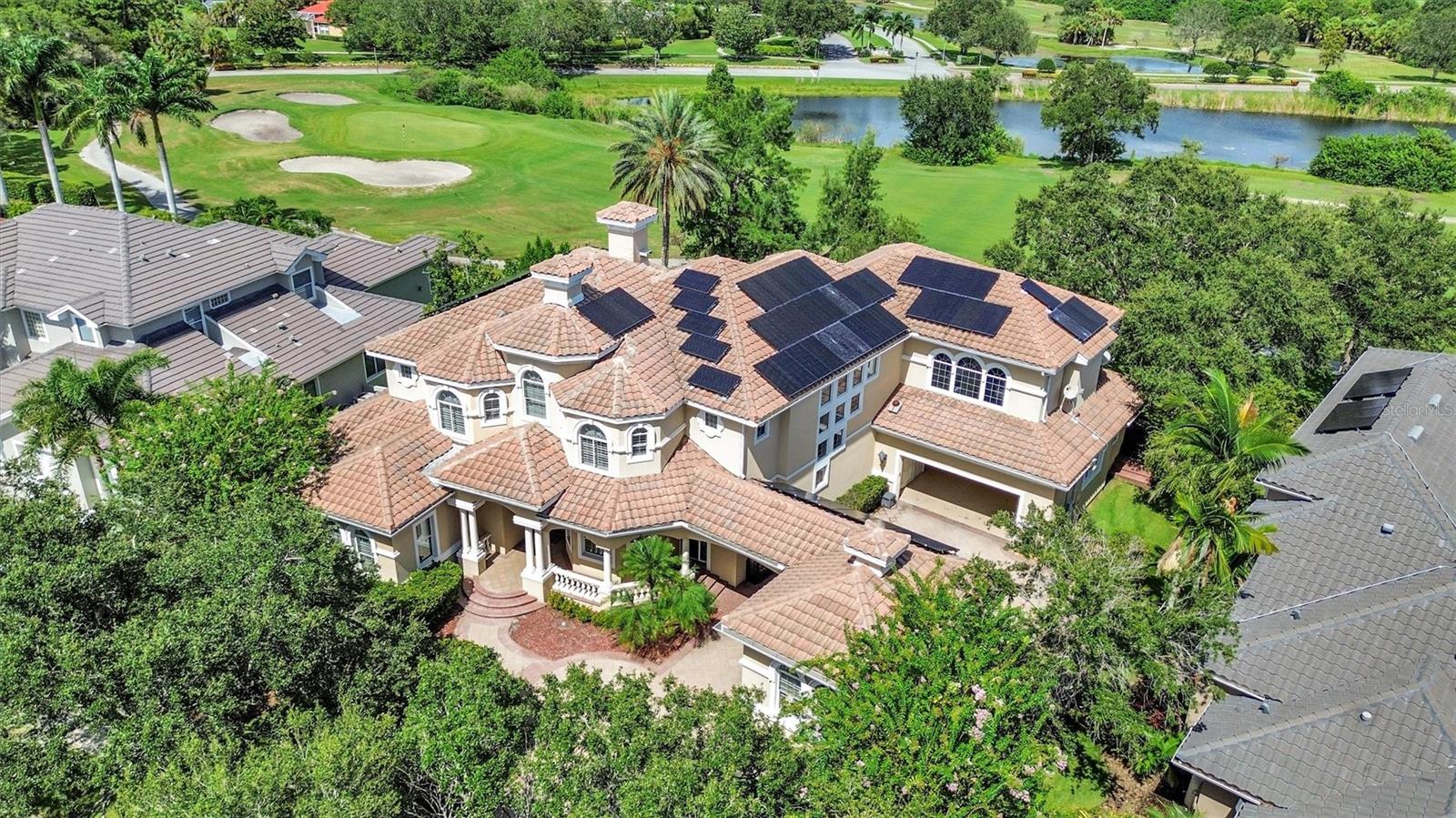 (IMPORTANT) ***Please watch the home tour video.*** With a recent appraisal surpassing $2,500,000 and over $300,000 in recent updates, this outstanding residence is priced to captivate discerning buyers, promising a limited opportunity to own a piece of elevated living. Accessible 1st level luxury with master suite, kitchen, and living areas on the first floor, supported by an elevator for convenient access to the second floor. Designed for ultimate entertaining, with expansive remodeled kitchen, doors opening to a pool oasis, and a versatile game room/theater combo for hosting gatherings. Crafted for sustainable living with 72 solar panels, EV charging, and remarkably low electric bills for a 6700 sqft home. Seamlessly integrated living, kitchen, and pool areas ensure you never miss a cherished moment with family and friends. Step into a harmonious residence designed to enhance connection and celebrate life's precious moments. Picture a home where the living area, kitchen, and pool are seamlessly intertwined, ensuring you're always present for every laugh, conversation, and celebration. This narrative of luxury and practicality continues upstairs, where a versatile game room/theater combo invites leisure and entertainment. Imagine the delight of relishing vintage arcade games or immersing yourself in cinematic marvels. A full gym with over $15,000 of gym equipment conveys with the home in the 3rd garage, making healthy living an easy daily convenience. Cultivate the mood of your day with a crisp, strong, sound from Sonos speakers throughout the home.
Outside, a pebble-finish pool, hot tub, and fountains create a serene outdoor haven. Elevated views from the expansive balcony provide incredible ways to enjoy nature and outdoor living. These features, coupled with the solar panels, underscore a home that seamlessly merges opulence and eco-consciousness.
Nestled within the legendary Bayou Club community, this residence offers more than just a home; it embodies a way of life. Situated conveniently near world class beaches and vibrant thriving cities, it marries luxury and functionality in perfect harmony. Your personal invitation to explore this exceptional dwelling awaits – reach out now to secure your private tour.