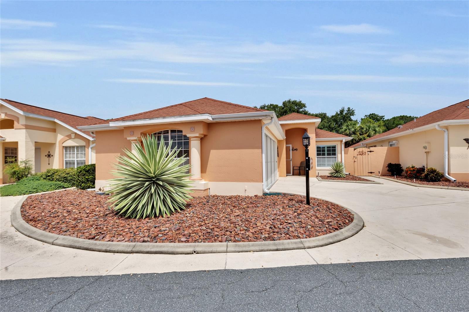 Turn-key NO BOND. Beautifully Remodeled 2BR/2BA Courtyard Villa with Golf Course / Water View. Welcome to your dream home in The Villages! This stunningly remodeled 2-bedroom, 2-bath courtyard villa offers the perfect blend of modern comfort and classic Florida charm—with breathtaking golf course and water views as your daily backdrop. Step inside to an open and inviting floor plan, featuring vinyl flooring, crown molding, plantation shutters and updated bathrooms. The kitchen has been tastefully upgraded with granite countertops and new cabinets, ideal for both entertaining and everyday living. The spacious living and dining area opens up to a private, fully enclosed courtyard—your own serene oasis for relaxing, gardening, or hosting guests. The primary suite boasts a beautifully remodeled en-suite bath, and walk-in closet. The guest bedroom and second full bath provides comfort and privacy for visiting family or friends. Enjoy your morning coffee or evening sunset from your back yard, where you can soak in the panoramic views of the lush golf course. Located close to recreation centers, golf, shopping, and dining, this villa combines luxury, location, and lifestyle in one of Florida’s most desirable 55+ communities. Don't miss this rare opportunity—schedule your private showing today!