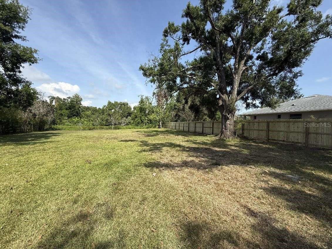 Rare find! Nearly half an acre vacant home lot on a quiet cul-de-sac and very close to all that Sarasota has to offer. There are extremely few ready to build lots in Sarasota, and this is central to everything (in the county but just outside of the city of Sarasota). The only vacant lot of the 8 properties in this mature, established, non-deed restricted neighborhood. There is no community association, so enjoy no HOA fees as well as the freedom to park your vehicles, boats or RVs on site. The lot is near lots of shopping, the newly renovated Bobby Jones golf course, and the Legacy Trail! Just a short drive to I-75, downtown Sarasota, and either Lido Key Beach or the modern UTC mall, and only 10 miles to the #1-rated Siesta Key Beach! It is a .42 acre shady lot on a pond that includes land on the far side of the water too that could be bridged with a gazebo on the other side. We did conceptualize making the lot into our own slice of paradise (see the picture) but had a change in family plans. Choose your own dream home and bring your own builder. No utilities currently on the site, but the property can be connected to county water & electricity (requires septic tank installation). Serious purchase inquiries only.