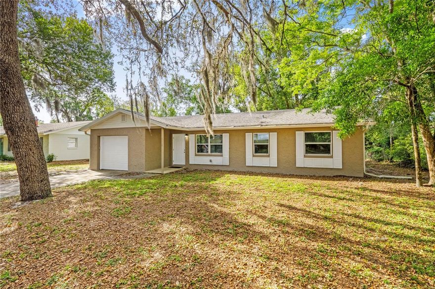 Move-in Ready and Priced to Sell! Beautiful 3 bedroom, 2 bathroom home with brand new flooring and painted walls- ready for its new owners! Great starter home for a small family or for someone looking to downsize. Nestled on a quiet street with a HUGE backyard surrounded by beautiful trees. Conveniently located close to downtown Deland and minutes from I-4. Windows, A/C, electrical were all updated in 2018. Come take a look!