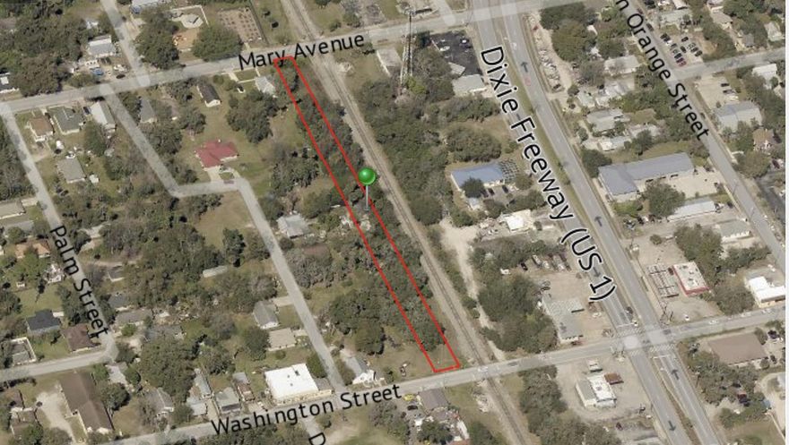 Long and narrow parcel of land located just west of the railroad tracks.