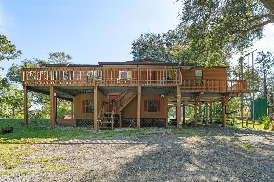 Appraised at $250,000! Enjoy front-row sunsets and riverfront adventures from this 3BR/2BA home on the Suwannee River! Featuring a private floating dock, screened porch, open deck, and lower-level covered parking with storage and chair lift access. Ideal for year-round living or a relaxing getaway. Just minutes from a public boat ramp and located off the main road for peaceful privacy. Don’t miss your chance to own this beautiful slice of riverfront living! This property does needs some TLC.