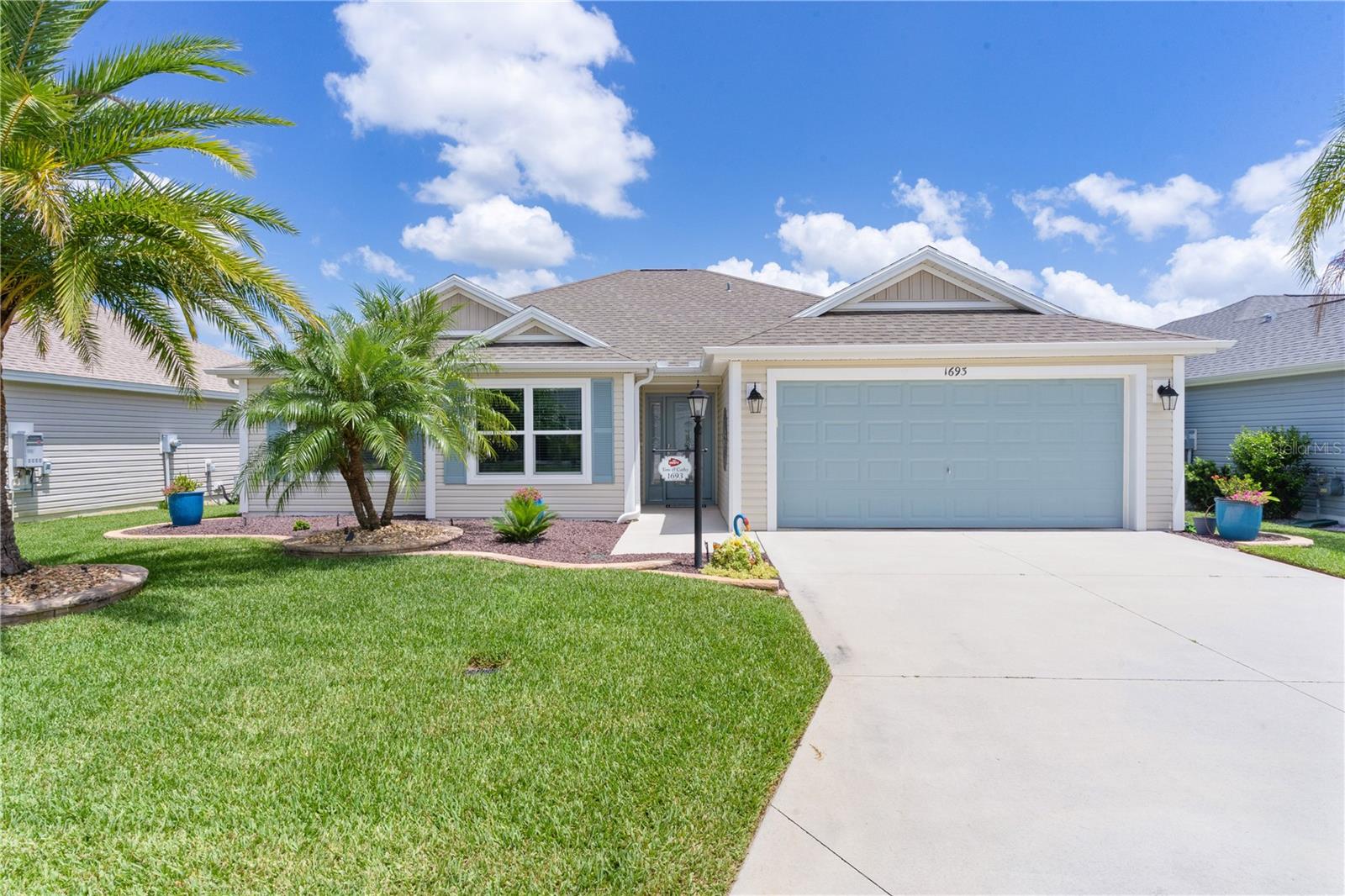 Welcome to this beautifully enhanced Whispering Pine model nestled in the highly sought-after Village of Monarch Grove in The Villages, Florida! Monarch Grove is centrally located between Brownwood and Eastport, south of highway 44. This 3-bedroom, 2-bathroom, 2 car garage home is packed with thoughtful upgrades and offers comfortable living with peace of mind and modern touches throughout.
From the moment you arrive, you’ll notice the enhanced landscaping complete with custom lighting that sets the stage for this inviting home. Step through the elegant glass front door into a light-filled interior boasting luxury vinyl plank flooring throughout — no carpet in sight!
The open-concept kitchen is a chef’s dream with granite countertops, pendant lighting, a solar tube for natural light, and upgraded sinks and faucets. You'll love the extra storage under the island, and the Culligan water filtration system including reverse osmosis in the kitchen ensures the highest water quality. Even the laundry room features granite counters and stylish finishes.
Relax year-round in the enclosed lanai featuring ceramic tile flooring, its own mini-split system for heating and cooling, and added insulation to ensure comfort. Whether entertaining guests or enjoying your morning coffee, this space is sure to become a favorite.
Other key features include:
• Newly painted interior
• Garage door entry for convenience
• Lifetime termite protection (attic and ground)
• Gutters surrounding the entire home
• Attic insulation for energy efficiency
This home is a rare find with an unbeatable combination of location, upgrades, and move-in-ready condition. Enjoy all that The Villages lifestyle has to offer from the comfort of a home that has already done all the work for you. Some furniture pieces and garage shelving available separately.
Don’t miss your chance to own this gem in Monarch Grove!