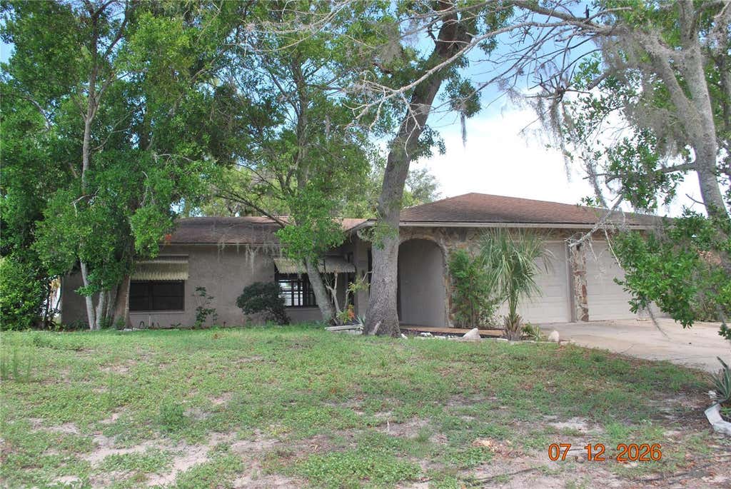 Photo of 8941 Forest Lake Drive, Port Richey, FL 34668 (MLS # TB8529674)
