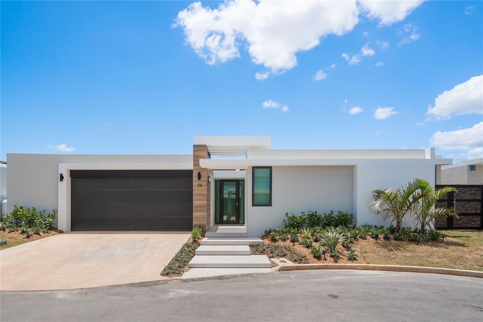 Step into the perfect blend of modern design, comfort, and peace of mind with this recently built single-level corner home, ideally set at the end of a private street in the sought-after Residences at RÃo community. This prime location offers quick access to top private schools, while providing the security and lifestyle you deserve 24/7 gated security, a resort-style pool, a fully equipped gym, and sports courts.
Energy independence is yours with a powerful 19 kW Caterpillar generator paired with a 158-gallon diesel tank and 27 solar panels, ensuring uninterrupted comfort year-round.
The home’s inviting outdoor spaces include a beautiful, covered terrace overlooking your private pool, perfect for entertaining or relaxing. Meticulously landscaped grounds surround the property, and a spacious storage area next to the garage provides room for all your essentials.
This 4-bedroom, 3.5-bathroom residence features a spacious kitchen, open-concept living and dining area, and a dedicated laundry room. Enjoy the ease of move-in readiness with brand-new appliances, window curtains, and more included in the sale. This home is a rare opportunity to own a modern, secure, and energy-efficient property in one of Bayamón’s most desirable neighborhoods.
Contact us today to schedule your private showing and see firsthand why this home is the perfect choice for your next chapter.