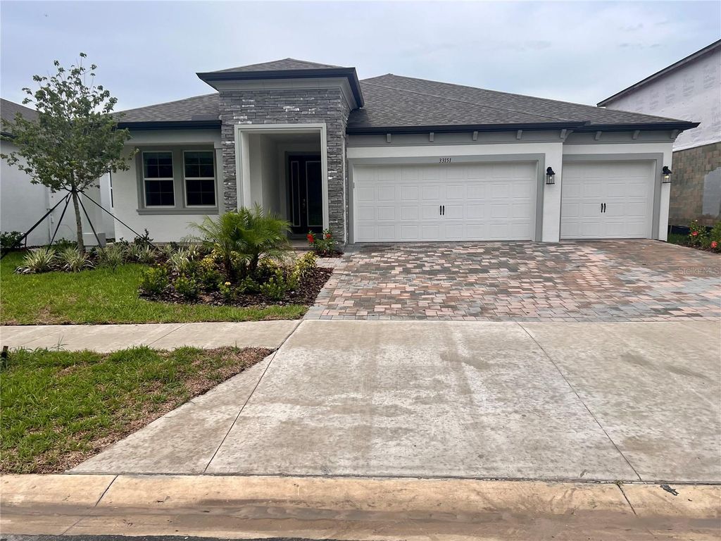 Photo of 33151 SYCAMORE LEAF DRIVE, WESLEY CHAPEL, FL 33545 (MLS # J963715)