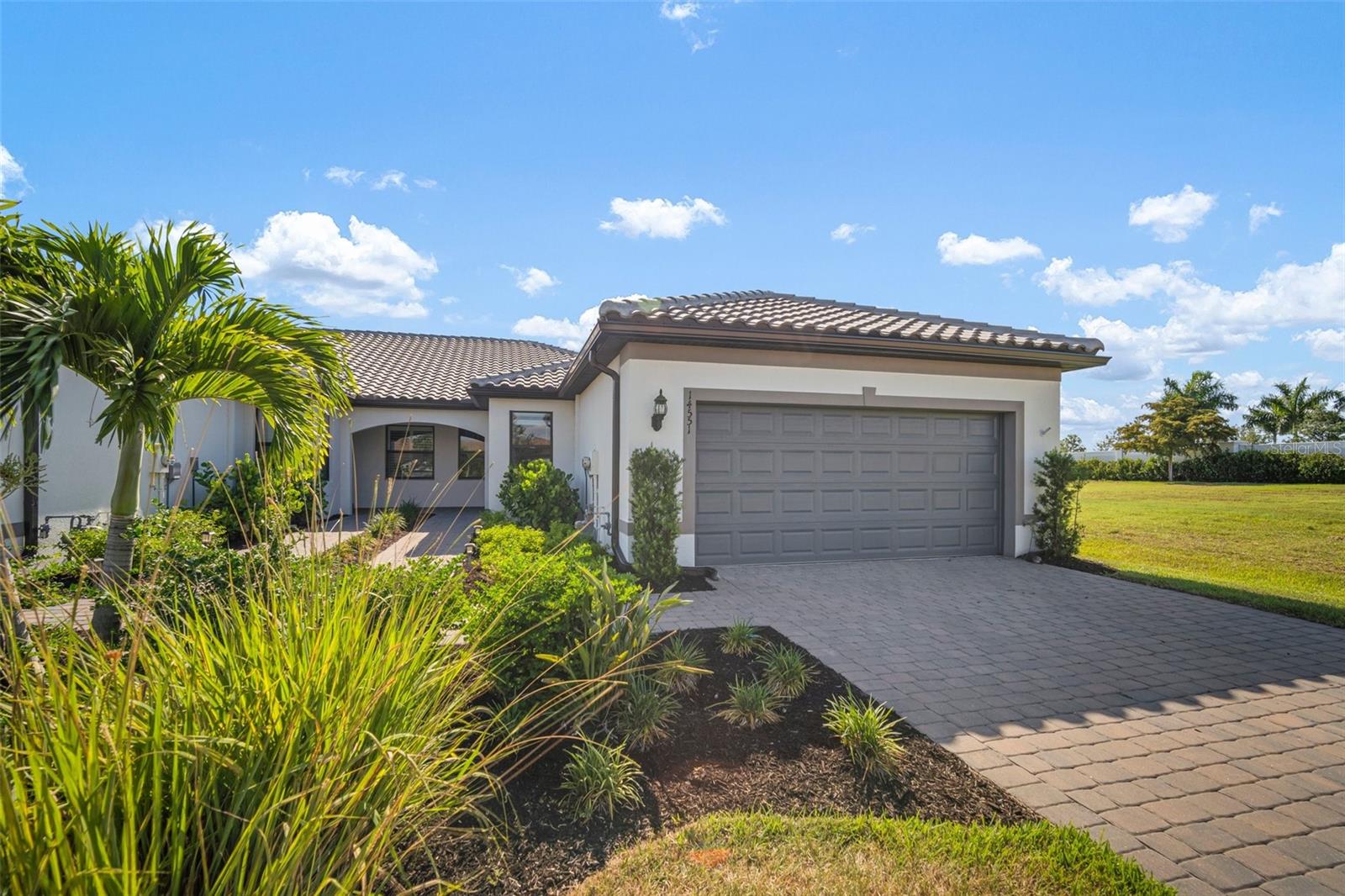 YOUR DREAM FLORIDA LIFESTYLE AWAITS YOU! This home is located in one of the most sought after neighborhoods in Sarasota, Talon Preserve on Palmer Ranch. Located just 5 miles to the Gulf of Mexico, where you will find yourself going to relax and catch the most amazing sunsets. If you are not at the beach or dining at one of the many waterfront restaurants nearby, you will be sitting on your lanai enjoying the view you always dreamed of. This rare, end of cul-de-sac, end unit with additional green space makes your home light and bright any time of the day. Not only will you be able to enjoy all that this spectacular home has to offer, you will find yourself thriving in one of the best MAINTENANCE FREE communities in Sarasota, Talon Preserve on Palmer Ranch (the best amenity rich community in the area) - resort style pool, spa, restaurant & bar, fitness center, group fitness classes, tennis courts, pickleball courts, bocce ball, playground, game room, and so much more! All this with a low HOA and no CDD fee. As you enter the home, you will be welcomed with an open floor plan with upgrades abounding. The kitchen is nestled in the front left of the home and open to the dining room and the great room, with a water view beyond the extended oversized covered caged paved deck. You will find yourself enjoying the screened paver deck while you relax and sip your morning coffee or catch a spectacular sunset over the water. This home features hurricane windows, an extended screened lanai, gas appliances, offset porcelain floor tile, quartz countertops, crown moulding, forty-two inch cabinets, fans in all bedrooms, eight foot glass front door, epoxy floor in the garage, walk-in shower and so much more! This light, bright, open concept home is perfect for entertaining guests or just having the space to relax and enjoy the wonderful Florida lifestyle. Perfect as either a vacation retreat or living in paradise year-round. Imagine living in a location that on any given night you can grab dinner on the beach while enjoying a sunset. If you crave variety, you have 10 different city and county beachfront parks all within minutes. They include: Nokomis Beach, South Jetty Beach, Venice Beach, Venice Fishing Pier, Caspersen Beach, Caspersen Park Canoe and Kayak Launch and Brohard Paw Park (the county's only dog friendly beach). You will also be pleased to find that this home is not located in a flood zone.