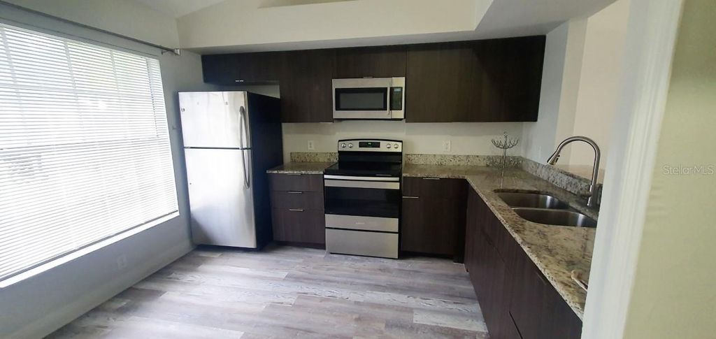 Photo of 1215 Barefoot Bay Drive, Orlando, FL 32824 (MLS # O6419010)