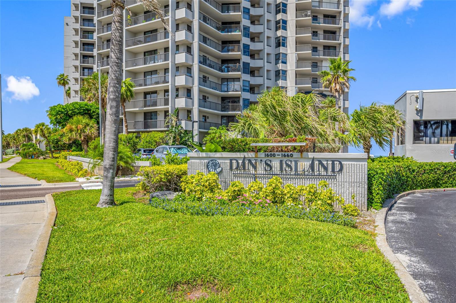 STUNNING DIRECT GULF FRONT views in this luxurious upscale residence in the presigious Dan's Island located on Sand Key. Live like you are on a constant vacation while you take in breathtaking unobstructed 180 degree views of Sand Key, Clearwater Beach and the Intracoastal Waterway. Located on the 10th floor, this sophisticated 2 bedroom, 2 bath condo is fully furnished and ready for you to experience premier coastal waterfront living. Spacious and sunfilled rooms featuring open living and dining, split bedroom plan, each with its own private balcony and those amazing views! The layout has an easy flow between dining, kitchen and living room, making it perfect for entertaining guests. The kitchen is a chef's delight, with wood floors, high end appliance package, granite counters, and a cozy sitting area to enjoy your morning coffee and the seabreezes. The Elegant Primary bedroom has large slider doors to your own private sunfilled balcony. A beautiful spot to have a glass of wine in the evenings, while watching the gorgeous sunsets. Ensuite bathroom has large jetted garden tub, walk in shower, dual sinks, and walk in closet with drawers for storage. Secondary bedroom has an adjacent full bath, large walk in closet, private sitting area and its own balcony for relaxing and peaceful reflection while watching the waves. The laundry room offers extra storage and full size washer and dryer. Dan's Island offers 24 hour guard gate and manned security, HUGE clubhouse with gulf front balconies and decking, private beach access, luxurious amenities including heated inground pool and spa, grill and private eating areas, a fitness center, basketball court, top level clubroom with wet bar, billiards and kitchen. What are you waiting for? Come and enjoy the best of RESORT STYLE living!