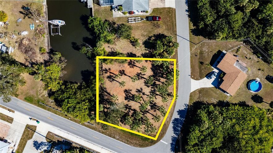 GREAT LOCATION AND EASY MOTORBOAT ACCESS TO Charlotte Harbor which leads to the Gulf of Mexico.  This is an oversized corner saltwater lot located on a dead-end street so there is very little traffic. The lot is cleared and ready to build on!  The property also has public water and sewer available. The location offers great accommodations for the boating enthusiast with easy idle to open waters. At the mouth of the canal is a public park, the Port Charlotte Beach Complex, which features a beach directly on the harbor, public boat ramps, public swimming pool, rec center, tennis court, basketball, playground, BBQ & picnic area. Must come and see!