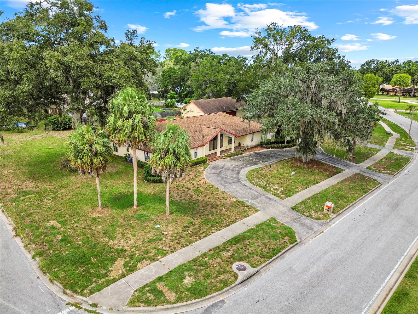 Step into this impressive 4-bedroom, 4-bath pool home in SE Ocala, perfectly situated on a spacious corner lot. Offering 3,000 sq ft of living space, this residence features two master suites, formal living and dining rooms, a cozy family room with fireplace, and a spacious kitchen. Designed for both entertaining and everyday comfort, the home opens to a private backyard with an in-ground pool and block wall for added privacy. Car enthusiasts and hobbyists will love the three-car attached garage plus an additional four-bay detached workshop. this home blends style, functionality, and peace of mind all just minutes from schools, shopping, and downtown Ocala.