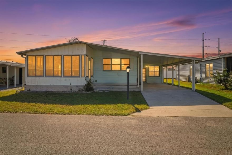 Welcome to Lake ‘N Golf Estates! This well-maintained 2-bedroom, 2-bath double-wide manufactured home is situated on 0.09 acres of land that you own, in one of Winter Haven’s desirable 55+ lakefront communities with direct access to the Lake Henry Chain of Lakes.

Offering 1,296 sq ft of heated living space, the home features a spacious open layout, large living room, dedicated dining area, and an eat-in kitchen with ample cabinet storage and pantry. The primary suite includes a walk-in closet and private bath, while the guest bedroom also offers a walk-in closet and convenient access to the second full bathroom.

Enjoy Florida living year-round with a bright Florida room, enclosed porch, and additional workshop/storage space—ideal for hobbies or extra storage. The covered carport and extended driveway provide convenient parking, and the home is being offered furnished, making it move-in ready.

Community amenities include a clubhouse, community pool, boat slips, and golf-cart-friendly streets. Low annual HOA fee covers common area maintenance, recreational facilities, and pool maintenance. Buyer approval required.

Conveniently located near shopping, dining, medical facilities, and Winter Haven’s renowned Chain of Lakes lifestyle. Whether you’re seeking a seasonal retreat or full-time residence, this home offers comfort, convenience, and classic Florida charm.