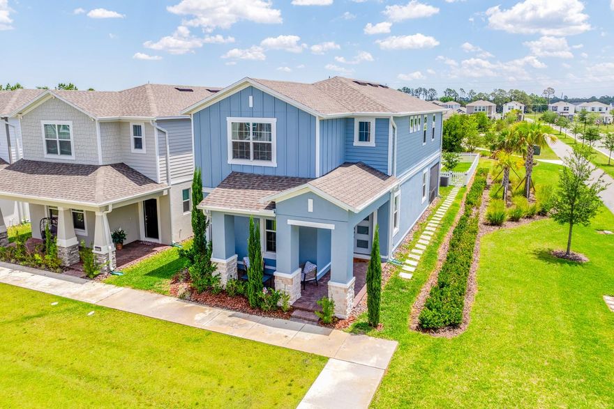 Why wait for new construction? This beautifully UPGRADED home in the sought-after Rivington community of DeBary is ready and waiting for you with over $125K in designer upgrades and every detail thoughtfully finished for you! BUILT IN 2024 and still in excellent condition, this MOVE-IN READY 4-bedroom, 3-bath home sits on one of the best lots in the community - a PREMIUM CORNER homesite with NO NEIGHBORS to the right, an L-shaped driveway, charming storybook-style picket fence, and easy access to the COMMUNITY POOL and amenities! Inside, the light-filled layout feels fresh, modern, and elevated from the moment you walk through the chic front door. WOOD LOOK TILE flooring throughout the main level and LUXURY VINYL PLANK upstairs means NO CARPET anywhere in the home. Crown molding, upgraded lighting, designer fixtures, and thoughtful finishes create a polished look throughout. Take note – upgrades include a stained staircase handrail with metal balusters, whole-house gutters, WATER SOFTENER, Ecobee thermostat, and a fully enhanced GOURTMET KITCHEN featuring a range hood, GE French door refrigerator, FARMHOUSE SINK with soap dispenser and air switch, POT FILLER, stacked upper cabinetry with crown molding, and a dramatic WATERFALL ISLAND that anchors the OPEN CONCEPT living and dining spaces. The versatile floor plan offers a MAIN FLOOR BEDROOM, a great opportunity for a second primary suite downstairs complete with an attached full bath, making it ideal for guests, multi-generational living, or a private home office setup. Upstairs, the luxurious PRIMARY SUITE becomes a tranquil retreat that delivers peaceful views, WALK-IN CLOSET, and a spa-inspired en-suite bath with a SEAMLESS GLASS SHOWER enclosure, upgraded tile surround, an oversized 10” rain showerhead, separate SOAKING TUB, dual/split vanities, and windows that fill the space with natural light. Back on the main floor, sliding glass doors off the dining space open to the SCREENED LANAI and fenced backyard, creating easy indoor/outdoor living with room to relax, entertain, or enjoy the peaceful surroundings with Konomac Lake as the scenic backdrop. Living in Rivington means more than just owning a home - it is a lifestyle! This thoughtfully planned 296-acre community along the scenic St. Johns River features RESORT STYLE AMENITIES including a pool, clubhouse, cabana, and picturesque walking trails. Conveniently located just minutes from I-4 and approximately a quarter mile from the DeBary SunRail station, commuting to Lake Mary, Sanford, and Downtown Orlando is simple. Outdoor enthusiasts will also appreciate being close to Gemini Springs, River City Nature Park, and the Central Florida Zoo & Botanical Gardens. This upgraded, turnkey home is ready now and truly has it all - call today to schedule your tour. Welcome to Rivington! **Seller may consider buyer concessions if made in an offer**