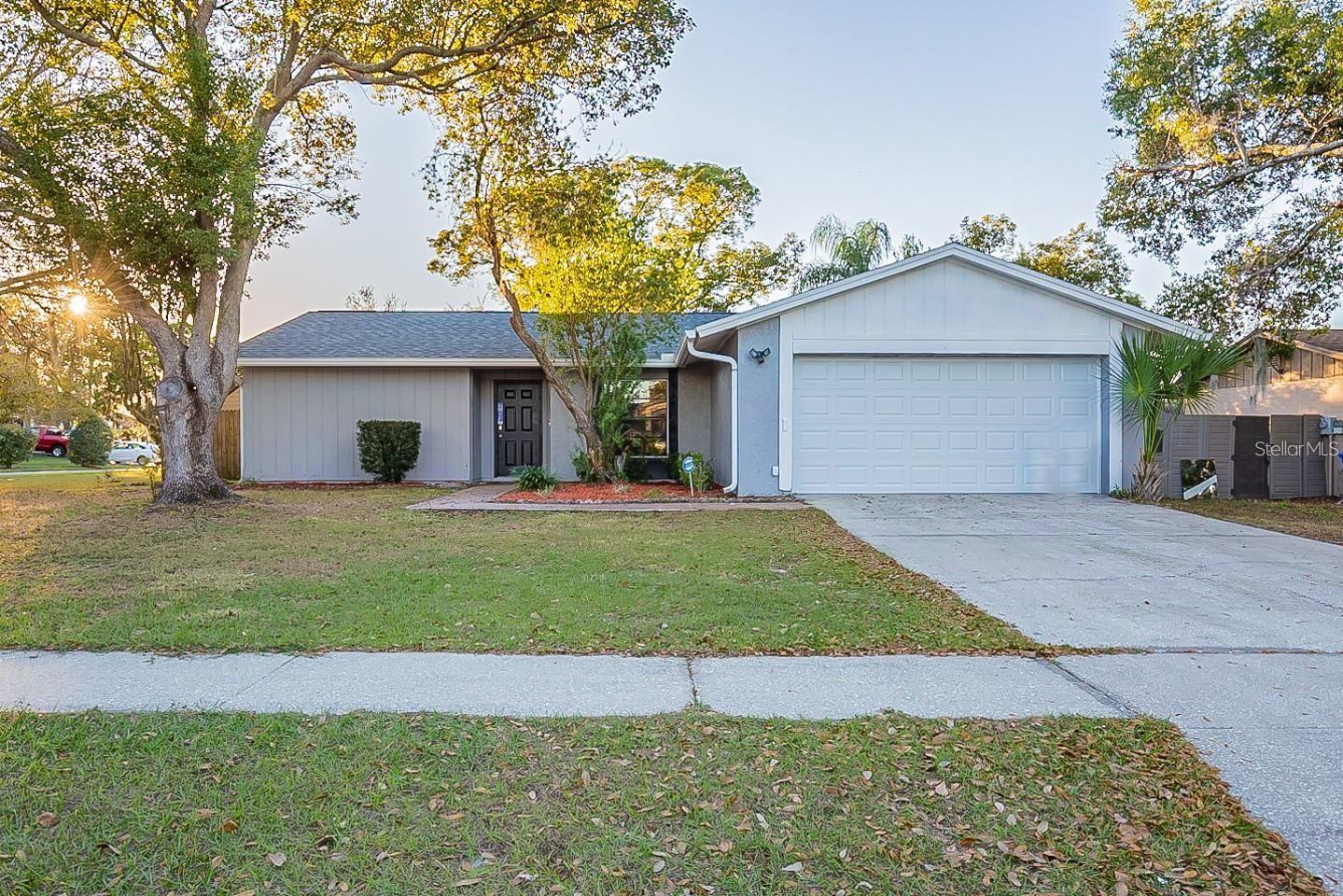 This jewel has been upgraded to feel like a contemporary home on an oversized corner lot and is ready for you to move in. It has tile throughout, and the kitchen was remodeled with beautiful oak wood cabinets, beveled counter tops, and a built-in microwave. The appliances are included. Don't miss your opportunity!!