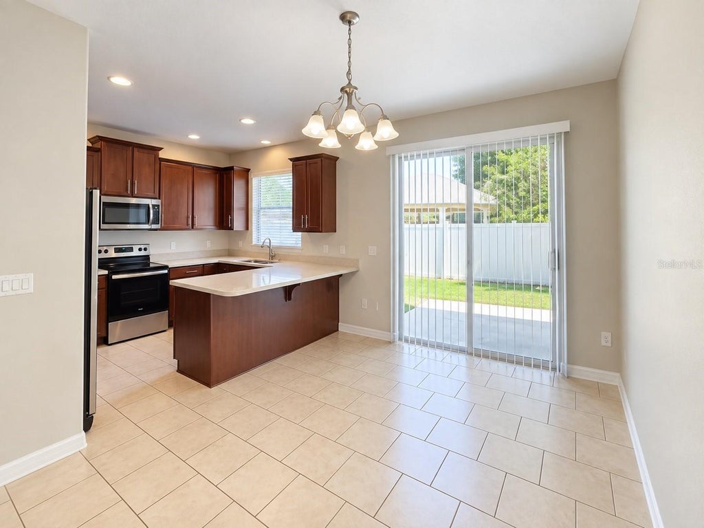 Photo of 9407 Tawnyberry Street, Orlando, FL 32832 (MLS # O6446450)