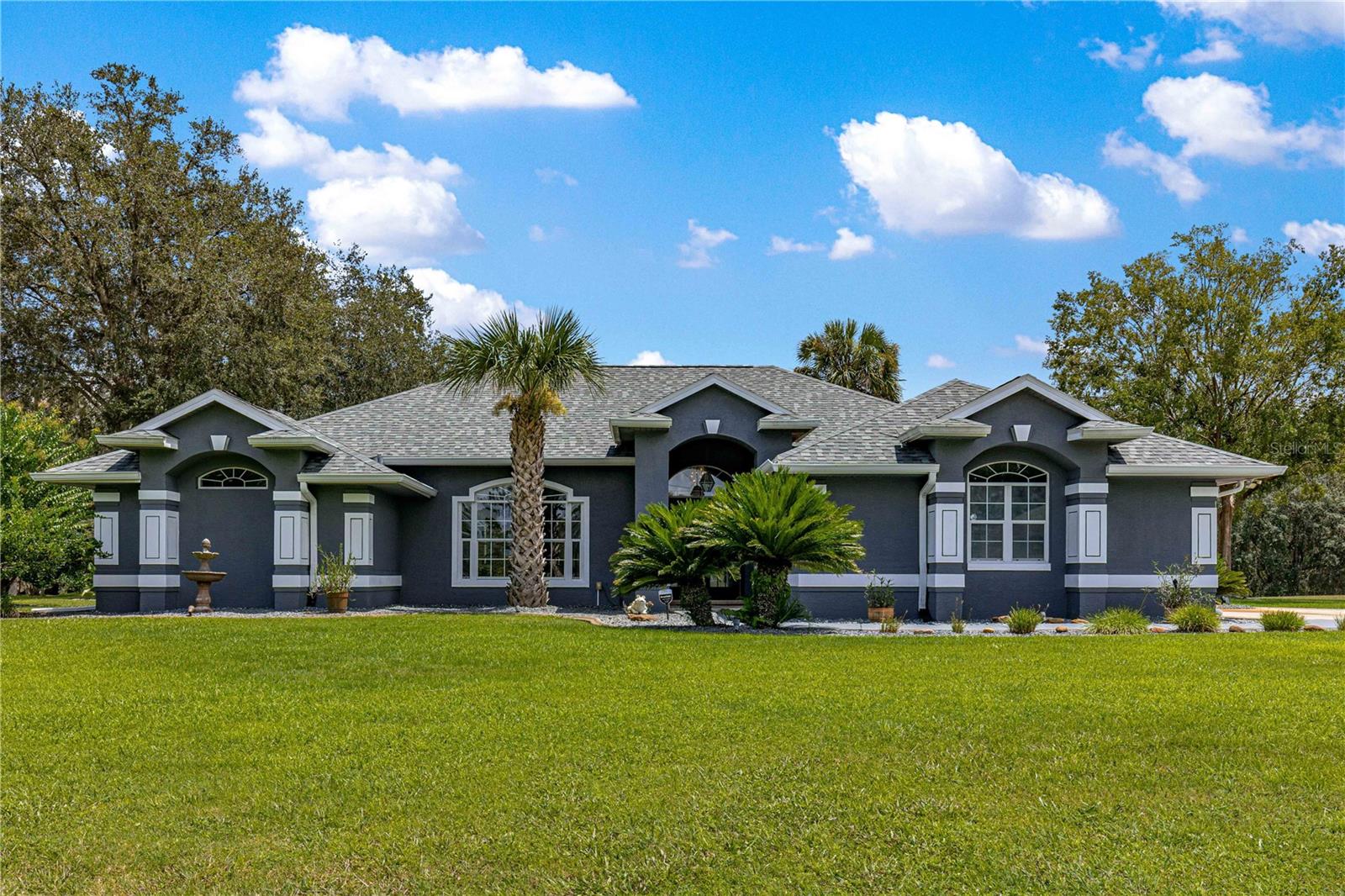 Ultimate Privacy & Outdoor Living on 1 Acre! Sitting on a full acre and backing up to 300+ acres of preserved land, this home offers unmatched privacy and abundant wildlife views while blending everyday comfort with resort-style amenities.
Inside, you’ll find a spacious 4-bedroom, 2.5-bath, split plan plus a dedicated office. The kitchen is a delight with granite countertops and stainless-steel appliances, opening to light-filled living areas. Durable tile and luxury vinyl plank flooring run throughout—no carpet here!
The expansive primary suite showcases vaulted ceilings and sliding glass doors opening directly to the pool, along with dual walk-in closets. The updated ensuite features quartz countertops, dual sinks, lighted vanity mirrors, and a beautifully tiled walk-in shower with a modern, spa-like design.
Step outside to your private backyard oasis! The screened pool with a separate shallow kiddie pool is perfect for both relaxation and play, with convenient access to the half bath right off the pool deck. Entertaining is effortless with a covered pavilion ready to be transformed into your dream outdoor kitchen, tiled outdoor dining space, cozy firepit, screened gazebo, and even a sandpit play area for little ones.
Additional highlights include: inside laundry, generator hookup, irrigation system, water treatment system, storage shed and fresh exterior paint.
All of this in a gated subdivision where you can enjoy tennis, basketball, bike rides, and evening walks. This family-friendly retreat combines privacy, function, and fun—schedule your private tour today!