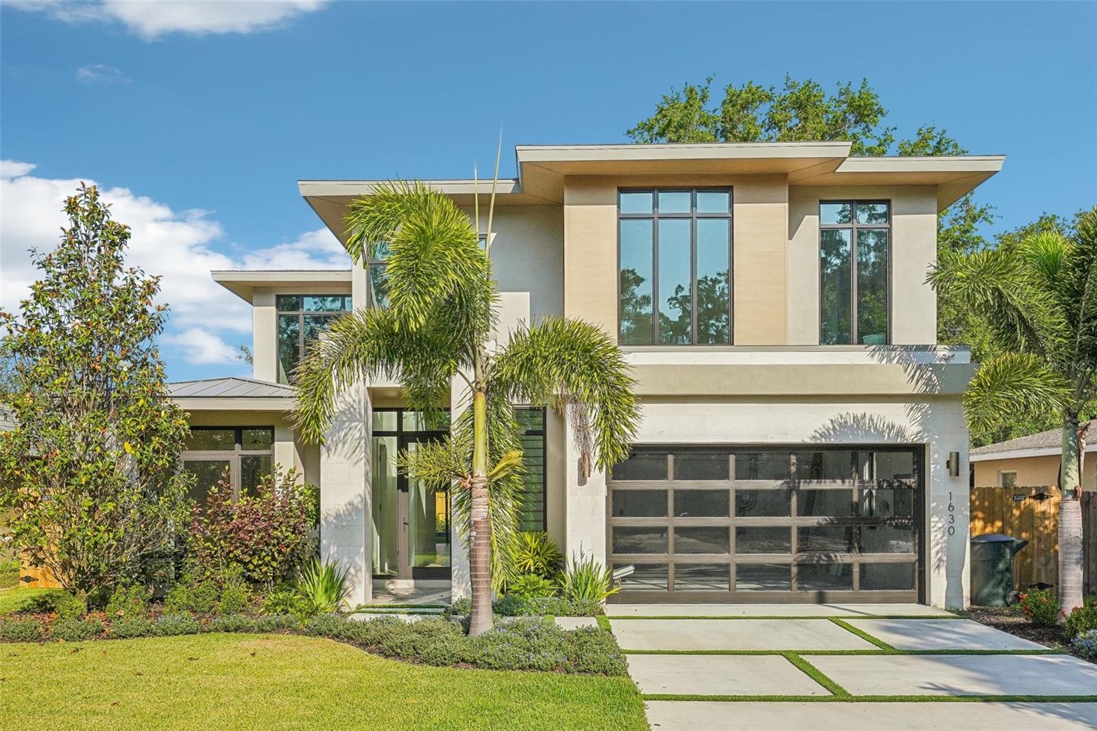 One or more photo(s) has been virtually staged. COMPLETED JANUARY 2025 – This brand-new, custom-built 4-bedroom, 3-bath home is located in the highly desirable Dunedin Isles neighborhood, directly along the Pinellas Trail. Offering 2,660 sq ft of living space (3,521 total), this two-story home was thoughtfully designed to embody the Florida lifestyle — blending light-filled interiors with seamless indoor-outdoor living.
Step inside to soaring ceilings, a dramatic 25-ft water vapor fireplace, and an open floor plan perfect for both entertaining and everyday comfort. The chef’s kitchen features a quartzite island, custom cabinetry, a walk-in pantry with first-floor laundry, and a premium Dacor appliance package. A 16-foot pocket slider opens to the screened lanai, while additional sliders connect directly to the west-facing backyard — ideal for capturing Florida’s sunset views.
The first-floor guest suite (or home office) includes an ensuite bath and walk-in closet, while upstairs, the primary suite offers a private sun deck, spa-style bathroom, and oversized walk-in closet. Bedrooms 3 and 4 share a modern Jack-and-Jill bath, and a second laundry area is located on the upper level for convenience.
Out back, enjoy a fully fenced yard, a sleek Spool with separate bath access, and direct entry to the Pinellas Trail — perfect for biking, running, or walking into downtown Dunedin.
Notable upgrades include: white oak engineered hardwood floors, Restoration Hardware lighting, built-in speakers (living room, primary, and lanai), Level 5 flat-finish walls, floating vanities, spray foam insulation, surge protection, and Samsung’s “The Frame” 85” TV — all curated to create a refined yet livable home.
No flood zone. No storm damage.
Note: Days on Market reflect time held during construction. This property was completed in 2025 and has never been occupied.
Enjoy a prime location just minutes from Honeymoon Island, top-rated schools, award-winning breweries, and the shops and restaurants of downtown Dunedin.