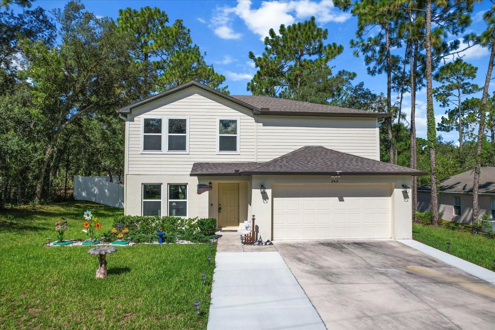 Built in 2022, this spacious two-story home offers 5 bedrooms and 3 full bathrooms, perfect for families or those needing extra space. The open floor plan features a generous kitchen with a walk-in pantry, an additional storage closet, and a convenient indoor laundry room. A brand new 4-ton A/C unit ensures year-round comfort, and the belt-driven garage door opener adds quiet efficiency to the two-car garage. Outside, you'll find a fully vinyl-fenced yard for privacy, full gutter system for proper drainage, and a welcoming back patio—ideal for relaxing or entertaining. This move-in ready home blends comfort, convenience, and modern style.