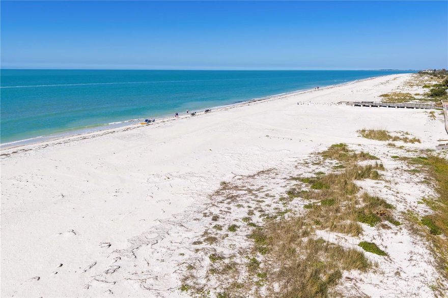 Welcome to your new beach house! Tucked away on a quiet residential street yet less than a mile from the vibrant energy of Clearwater Beach, world-famous Pier 60, dining, shopping and local attractions. Only one block to the sugar white sands of the beach, this elevated stilt home offers 2,052 square feet, featuring 3 bedrooms and 2.5 baths. A double-door entry opens into an enclosed foyer, take the elevator or the stairs to the main level. Lots of natural light through the windows into the great room layout. You’ll be drawn to the balcony to enjoy the partial view of the Gulf, ocean breezes and sunset skies!  The kitchen is both bright and functional, featuring a breakfast bar and ADA-friendly improvements including hospital grade laminate flooring, accessible counters, accessible cooktop, pull-down cabinetry and a push-button garbage disposal. The home includes a spacious master suite with a walk-in closet and ensuite bath offering a walk-in shower, soaking tub, and a double sink vanity. The 2nd bedroom features an ensuite ADA wet room with roll-in shower, grab bars, and pacemaker-safe design. A versatile loft with wet bar and cabinetry offers the perfect space for a home office or lounge, while a separate laundry room and hall storage add everyday convenience. Downstairs, the oversized 23x26 two-car garage and bonus room provide flexible space ideal for a party room, workshop, or storage. Outside, enjoy lush tropical landscaping with mature palms, a fenced patio with blue stone pavers, and new vinyl fence! ADDITIONAL UPGRADES: Impact sliding doors (2023), flat roof (2023), main roof (2024), vinyl fencing (2025), and a new balcony (2025). The ramps to the balcony and backyard for street access offer additional accessibility. Everyday conveniences like Publix, Walgreens, and dining are minutes away. With a 30-day rental minimum, this property also offers flexibility for personal use or investment. This is a rare opportunity to own an ADA-accessible coastal home in one of Florida’s most desirable beach communities.